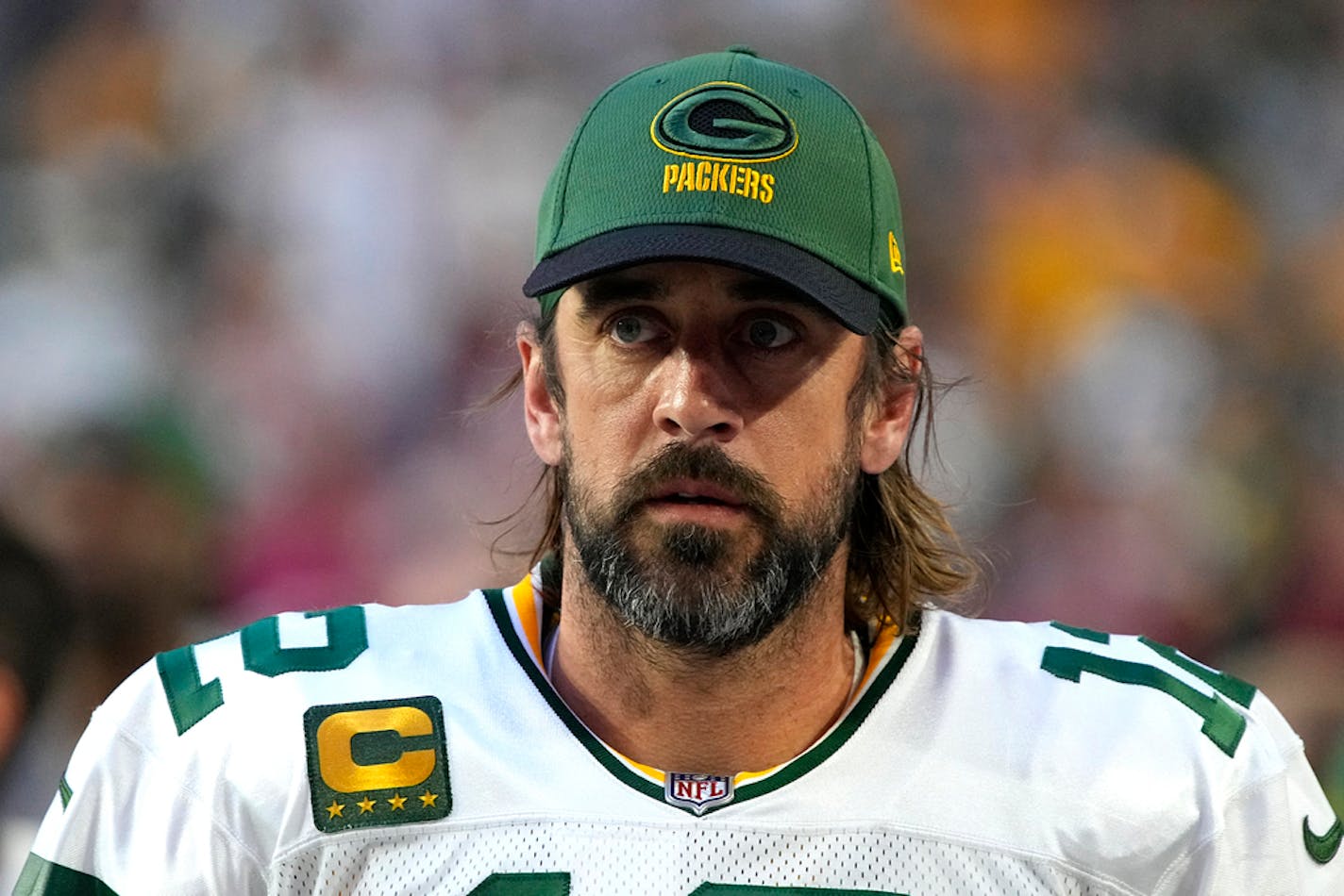 Green Bay Packers quarterback Aaron Rodgers (12) is shown during the first half of an NFL football game against the Arizona Cardinals, Thursday, Oct. 28, 2021, in Glendale, Ariz. Packers quarterback Aaron Rodgers has tested positive for COVID-19 and will miss Sunday's game at Kansas City, according to published reports. (AP Photo/Rick Scuteri)