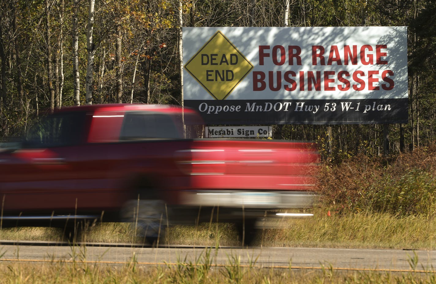 A billboard on Highway 53 Wednesday morning in Eveleth was part of a campaign against the relocation scenario that would bypass Eveleth. ] JEFF WHEELER &#x201a;&#xc4;&#xa2; jeff.wheeler@startribune.com A four-lane stretch of highway through the Iron Range is about to vanish into an open pit mine and the state only has a few years left to figure out where, and how, to build a new route for Highway 53. Eveleth would have been isolated if the cheapest plan were chosen, though that now appears unlik