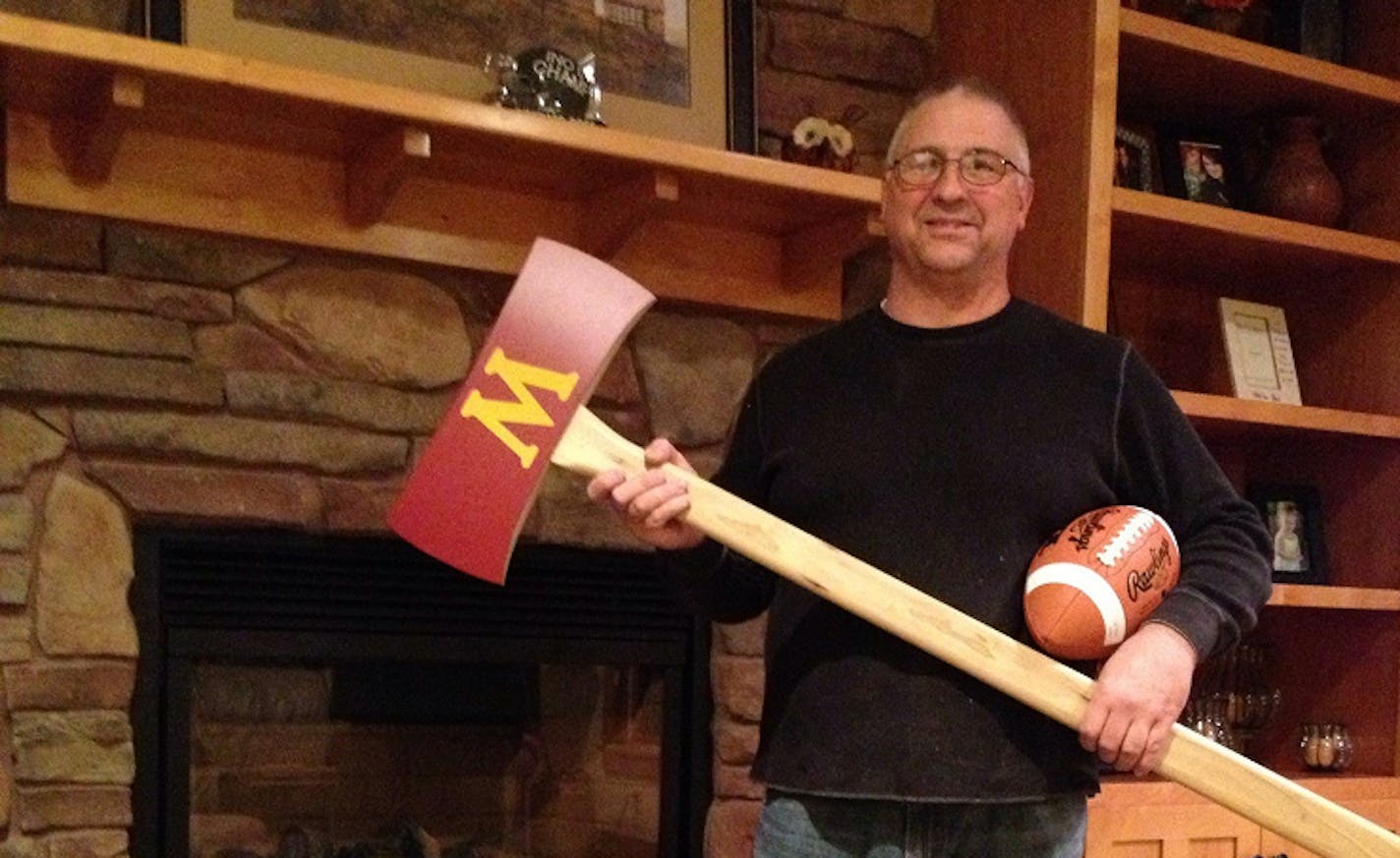 John Stock with his homemade replica of Paul Bunyan's Axe.