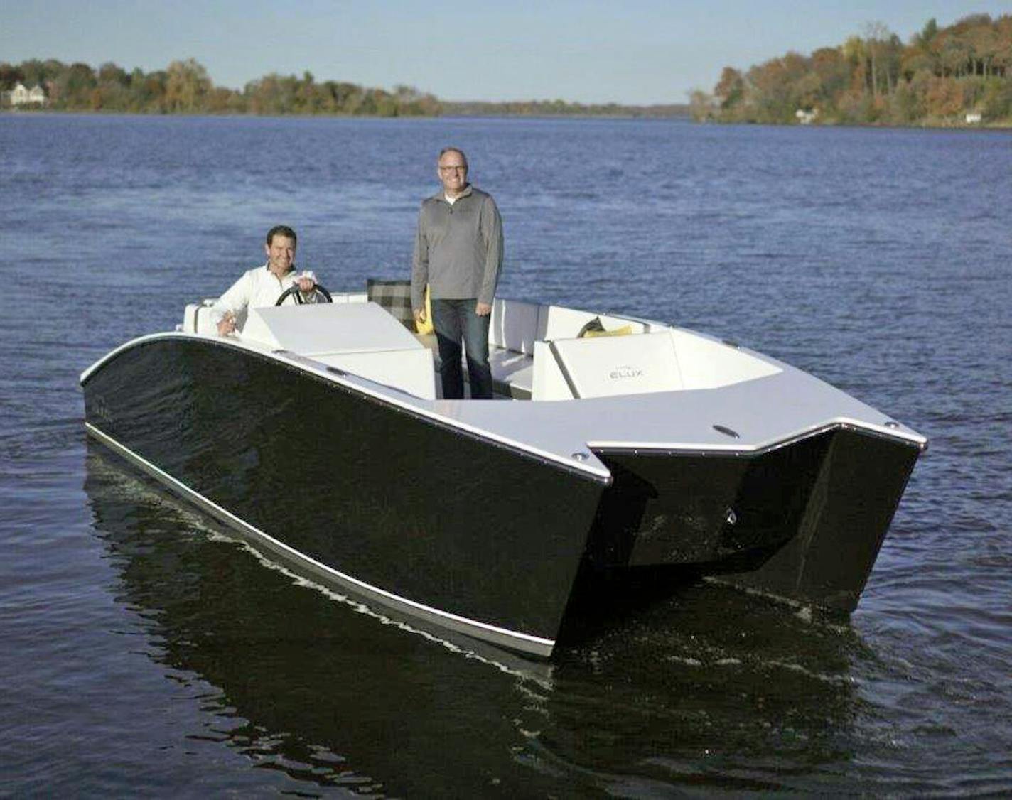 Elux Marine partners Bart Jones, a veteran boat renovater and designer, and Howard Root, the former CEO of Vascular Solutions, introduce their new Elux battery-powered pontoon boat this week at the Minneapolis Boat Show at the Minneapolis Convention Center. Photo: Elux Marine