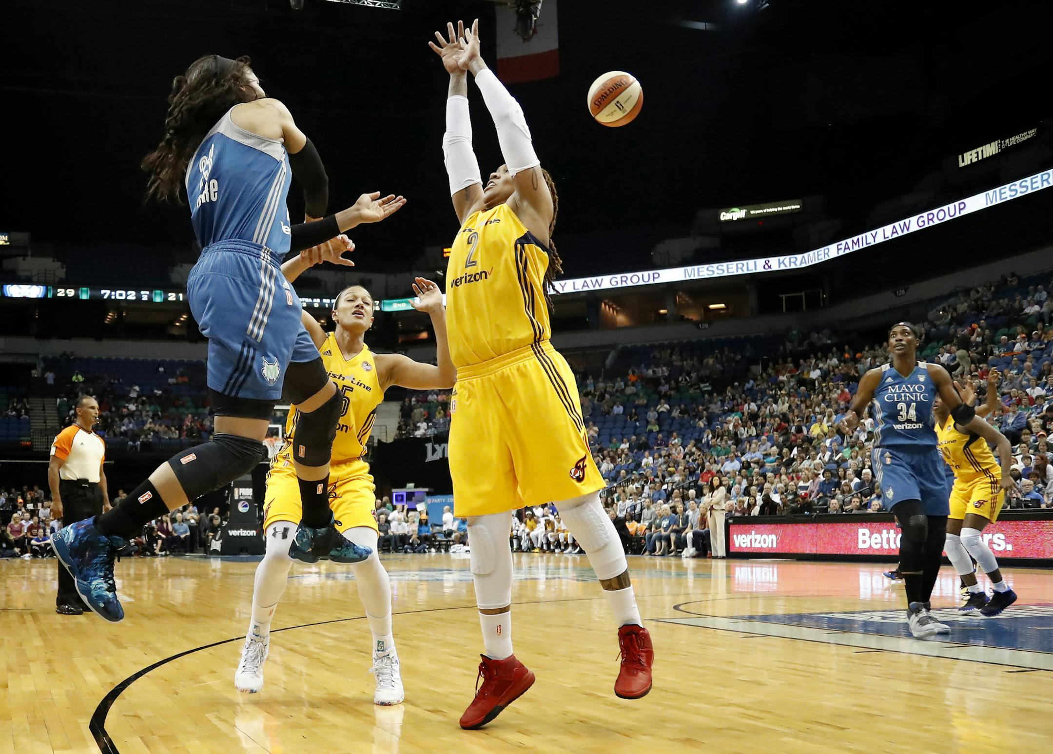 Maya Moore (23) passed the ball past Erlana Larkins (2) in the second quarter