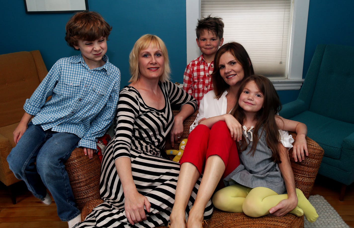 Left to right: Quintus Graff (blue shirt), Dori Graff, Murphy Skarstad (red checkered shirt) Mary Fallon, and Frances Skarstad (girl in front) in their Minneapolis office. ] JOELKOYAMA&#x201a;&#xc4;&#xa2;jkoyama@startribune Minneapolis, MN on June 2, 2014. Two local women have created a popular app for parents to sell and buy kids stuff. Kid clothing often has the quickest turnaround of buying and discarding. But the iPhone app (with 10,000 users) is more than just a marketplace, the parents buy