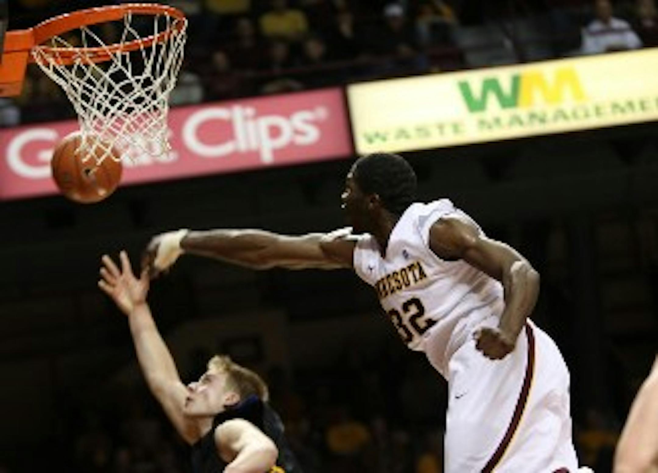 Gophers forward Trevor Mbakwe (right) announced Monday he is coming back for the sixth season of men's basketball eligibility granted to him recently by the NCAA.