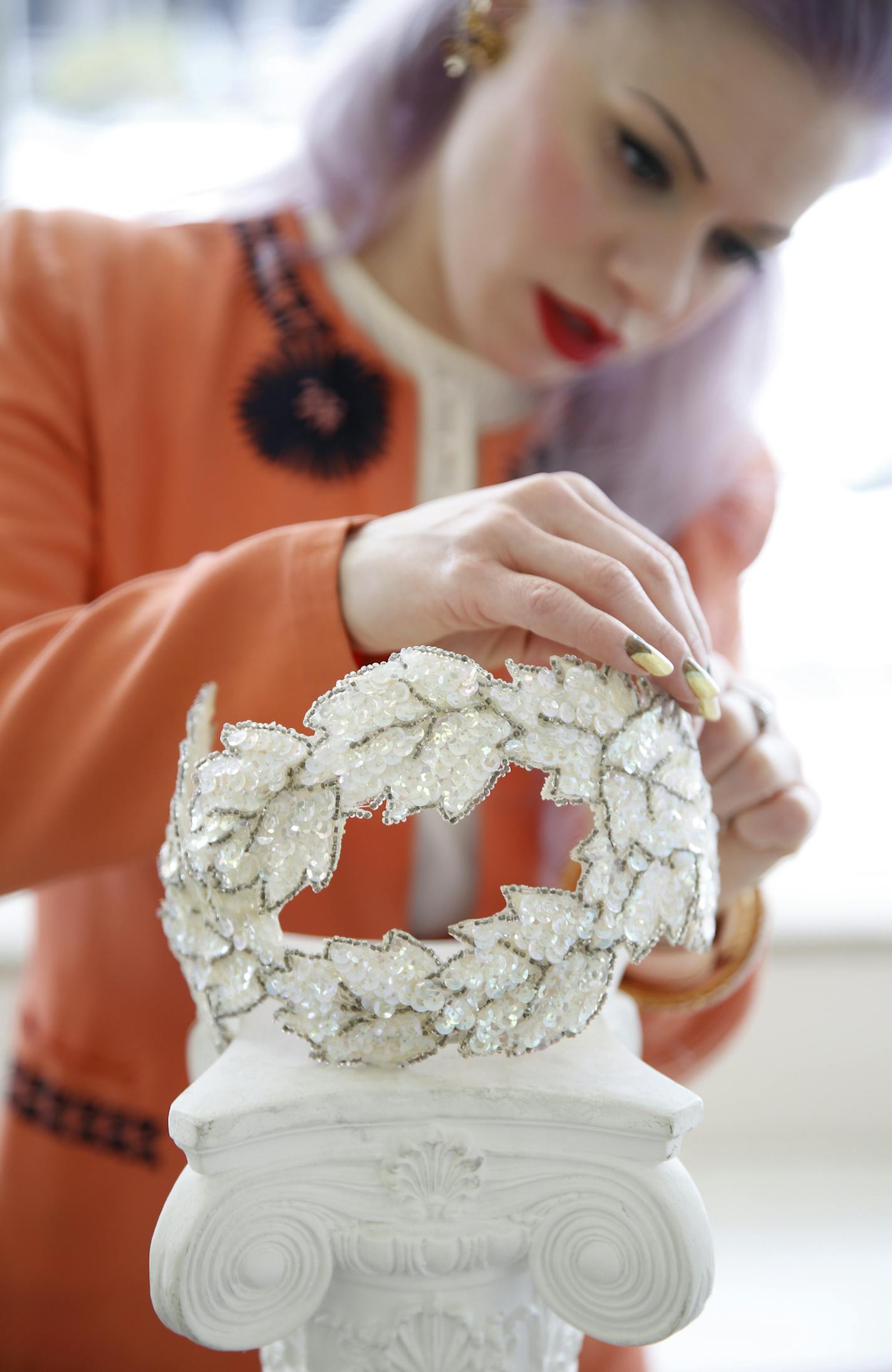 Nikolina Erickson-Gunther fixes a vintage bridal head piece at Andrea's Vintage Bridal in Minneapolis. ] LEILA NAVIDI leila.navidi@startribune.com / BACKGROUND INFORMATION: Monday, November 17, 2014.