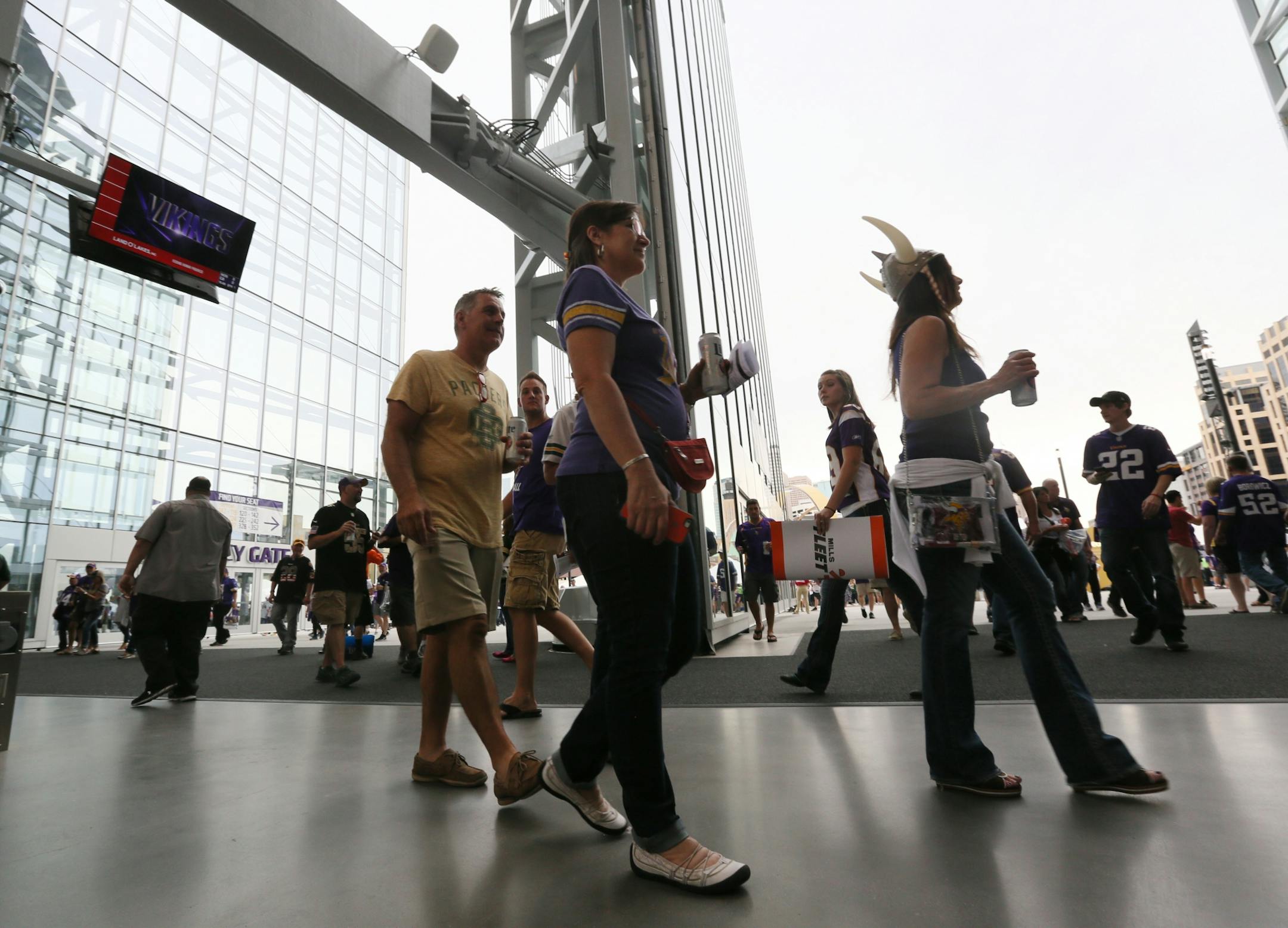 The Minnesota Vikings open the new US Bank Stadium for their first home regular season game against the Green Bay Packers. Here, the big doors opened Sunday afternoon to Viking fans ready for a new season and a new home.