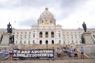 Around 25 people attend a rally outside the Minnesota State Capitol hosted by Students For Life of America to celebrate the Supreme Court overturning 