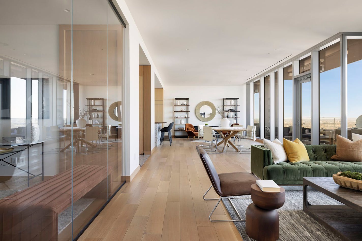 Unit 3405, a two-bedroom, three-bathroom plus den in the Four Seasons private residences in downtown Minneapolis, features a Nordic palette and floor-to-ceiling window views of the skyline and Mississippi River.