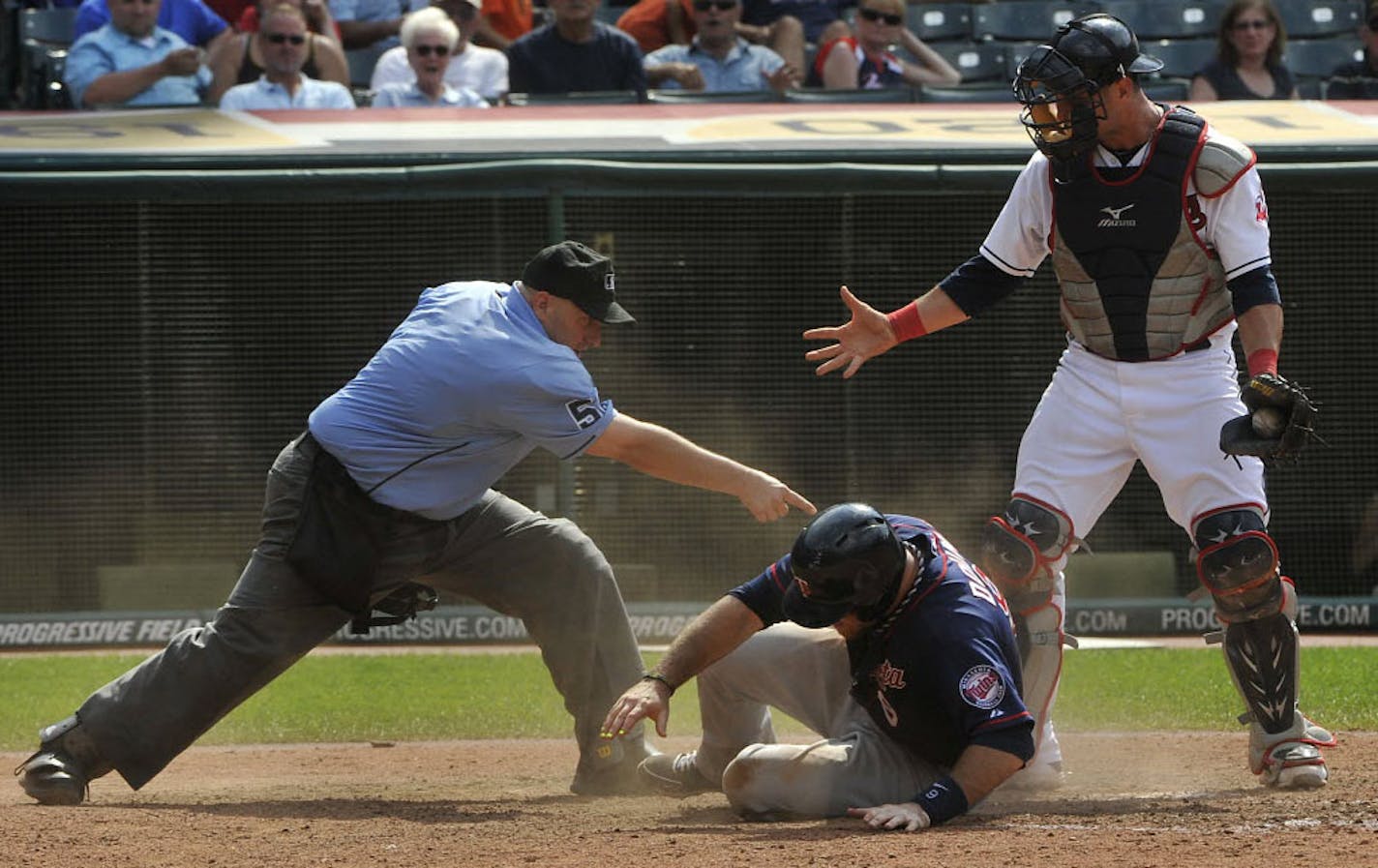 Cleveland catcher Yan Gomes pleaded his case, but home plate umpire Eric Cooper called the Twins' Ryan Doumit safe during the ninth inning Sunday.