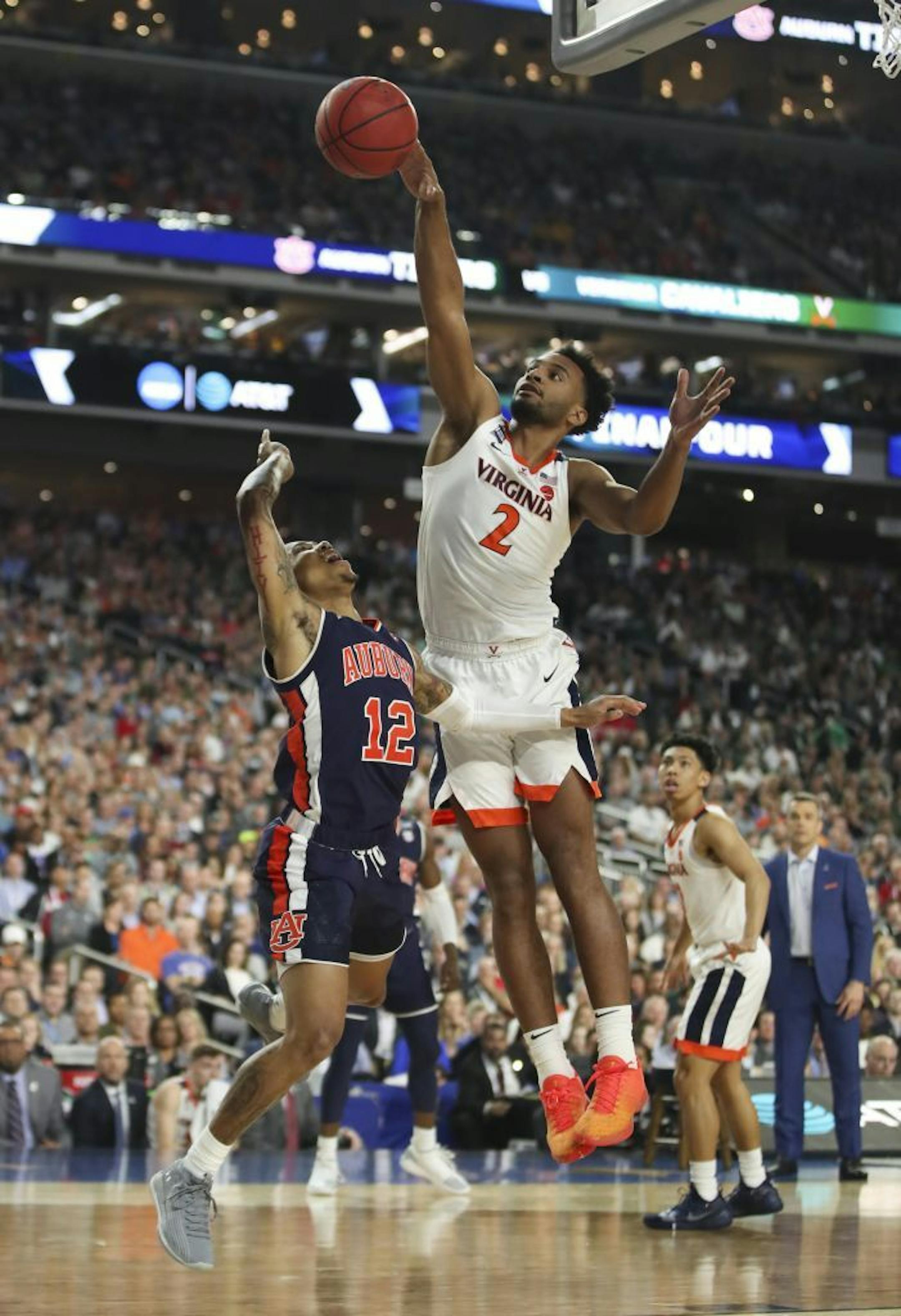 Virginia Cavaliers guard Braxton Key (2) swatted a shot by Auburn guard J'Von McCormick (12) during the first half.