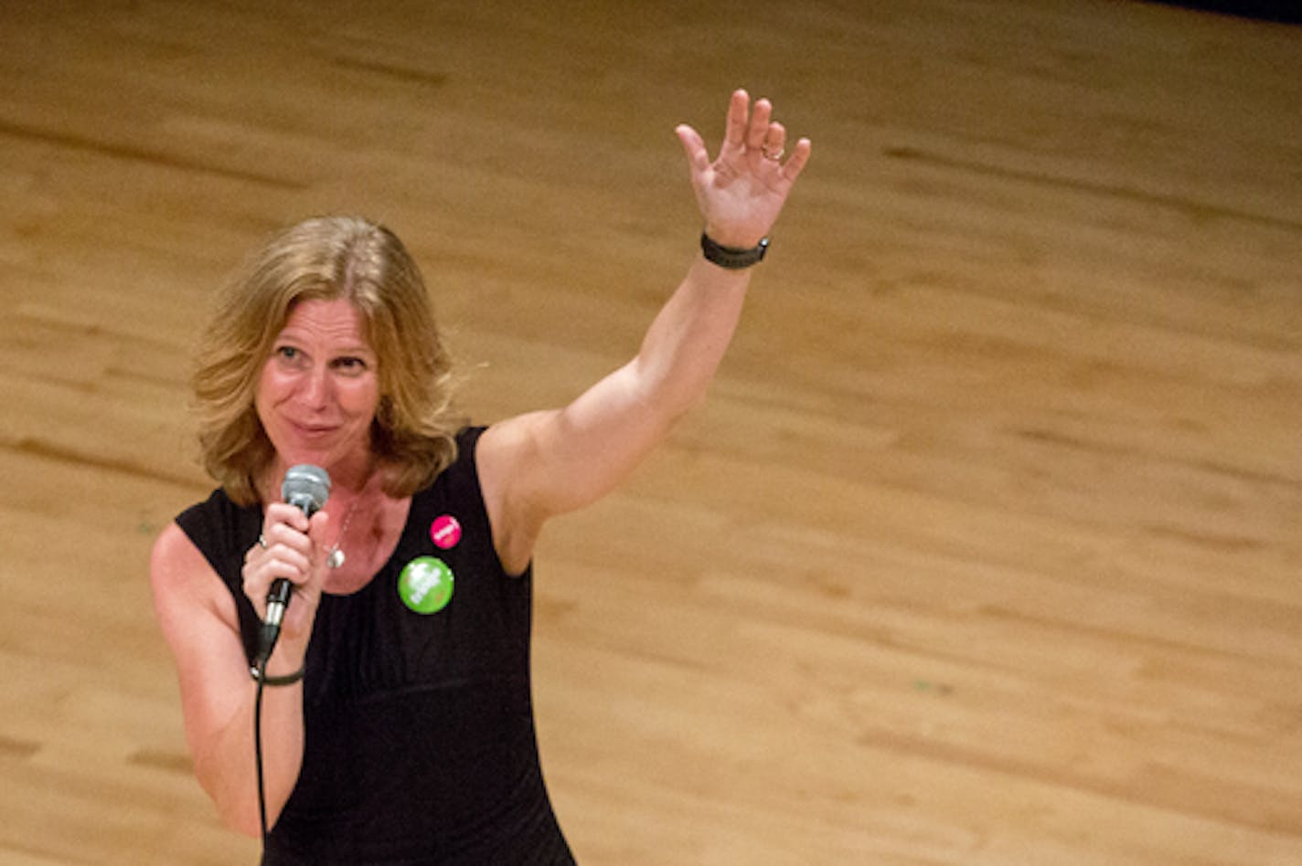 Minnesota Fringe Festival executive director Dawn Bentley speaks to the audience during preview night on Monday.