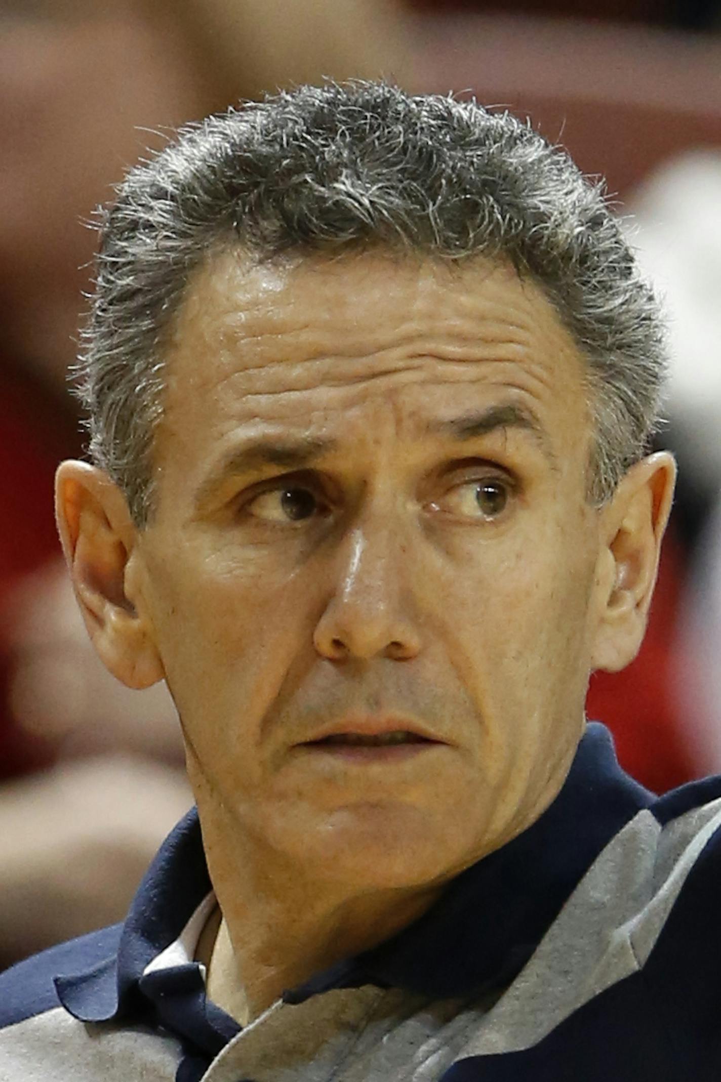 Akron head coach Keith Dambrot calls out a play against Miami in the second half at the Charleston Classic NCAA college basketball tournament in Charleston, S.C., Friday, Nov. 21, 2014. Miami defeated Akron 79-51. (AP Photo/Mic Smith) ORG XMIT: SCMS121