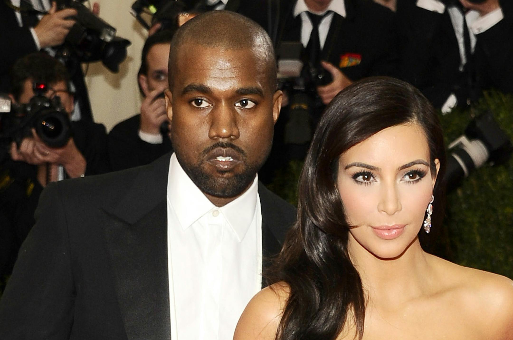 Kanye West, left, and Kim Kardashian