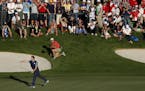 Rory McIlroy reacted after making a put on the 16th green to end his team's match during the afternoon round of the Ryder Cup at Hazeltine National Go