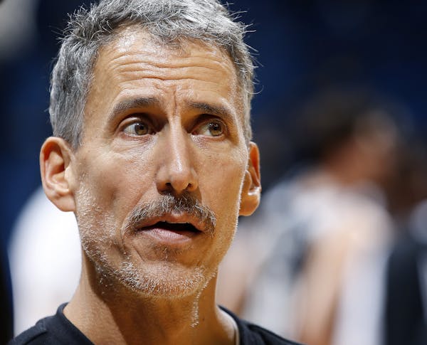Minnesota Timberwolves Vice President of Sports Performance Arnie Kander worked with players during warm ups before a team scrimmage on Monday. ] CARL