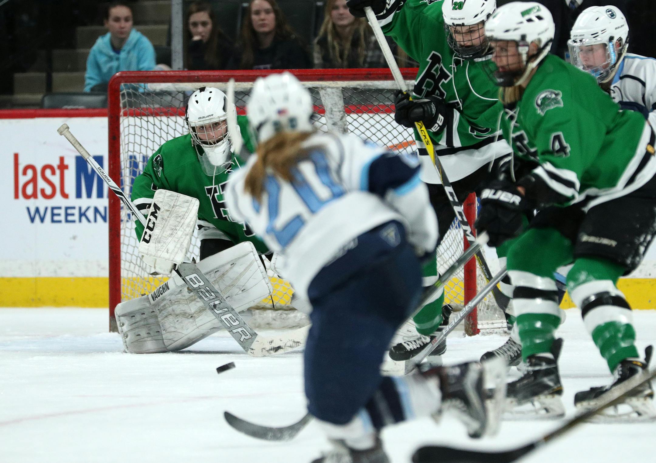 Blaine's Courtney Moser (20) took a shot on Hill-Murray goaltender Ava Bailey (1) during the first period . ] ANTHONY SOUFFLE • anthony.souffle@startribune.com Players competed in the Class 2A girls' hockey state semifinals Friday, Feb. 24, 2017 at the Xcel Energy Center in St. Paul, Minn.
