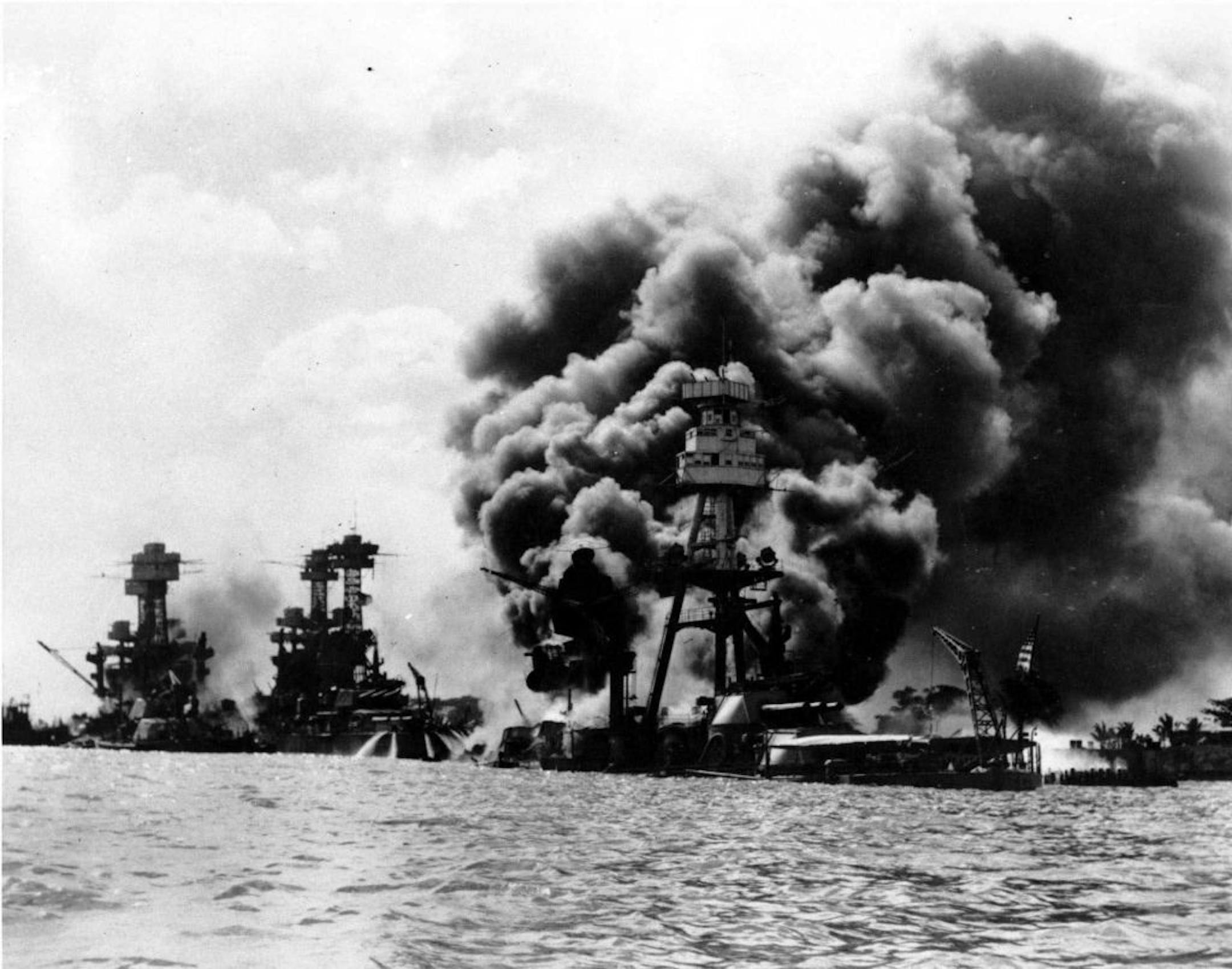 FILE--Three U.S. battleships are hit from the air during the Japanese attack on Pearl Harbor in this Dec. 7, 1941 file photo. From left are: USS West Virginia, USS Tennessee, both damaged; and USS Arizona, sunk. The terrorist assualts that occured Tuesday, Sept. 11, 2001, on the World Trade Center and at the Pentagon reminded many Pearl Harbor survivors of the 1941 Japanese attack on U.S. warships in Hawaii.