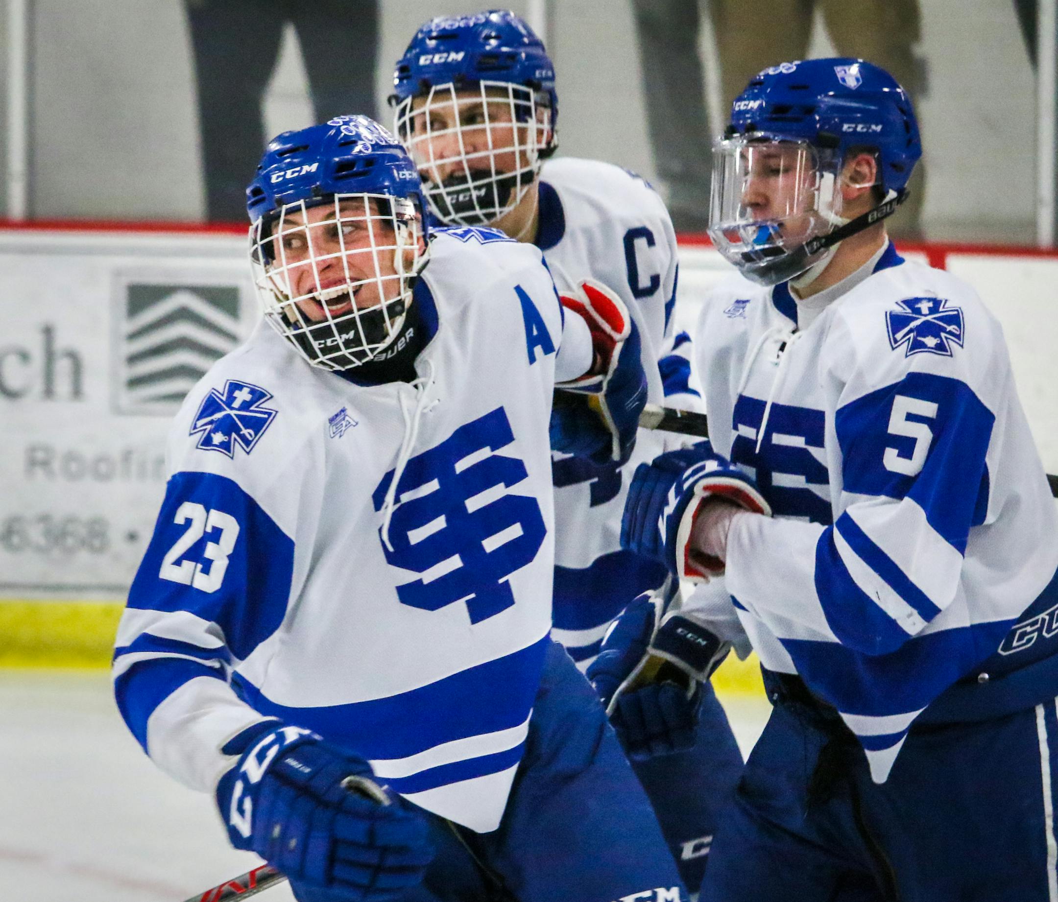St. Thomas senior Willie Reim (23) smiles after scoring his 2nd goal in the 2nd period. St. Thomas beat Eagan 4-1 in the Class 2A section 3 semifinals. ] MATT WEBER •