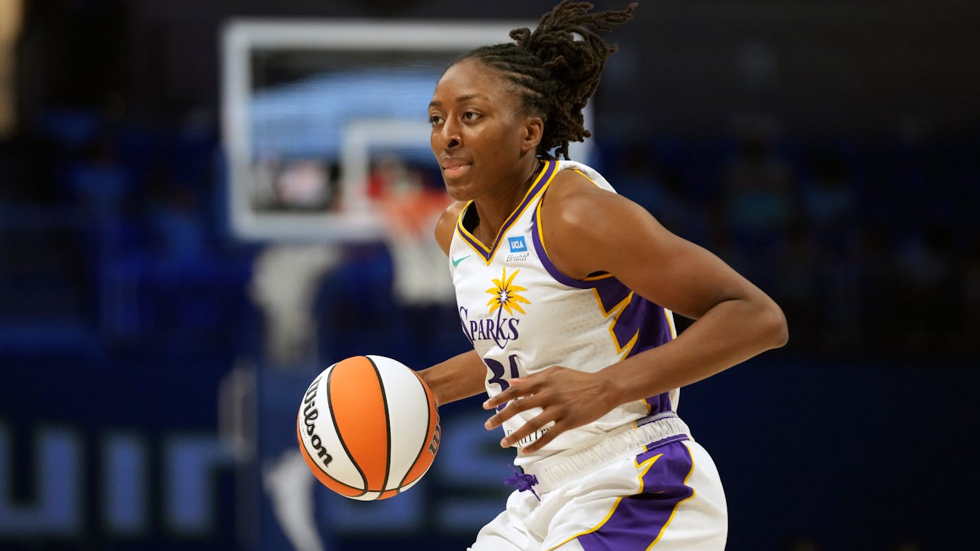 Los Angeles Sparks forward Nneka Ogwumike dribbles during the second half of a WNBA basketball basketball game against the Dallas Wings in Arlington, Texas, Wednesday, June 14, 2023. (AP Photo/LM Otero)