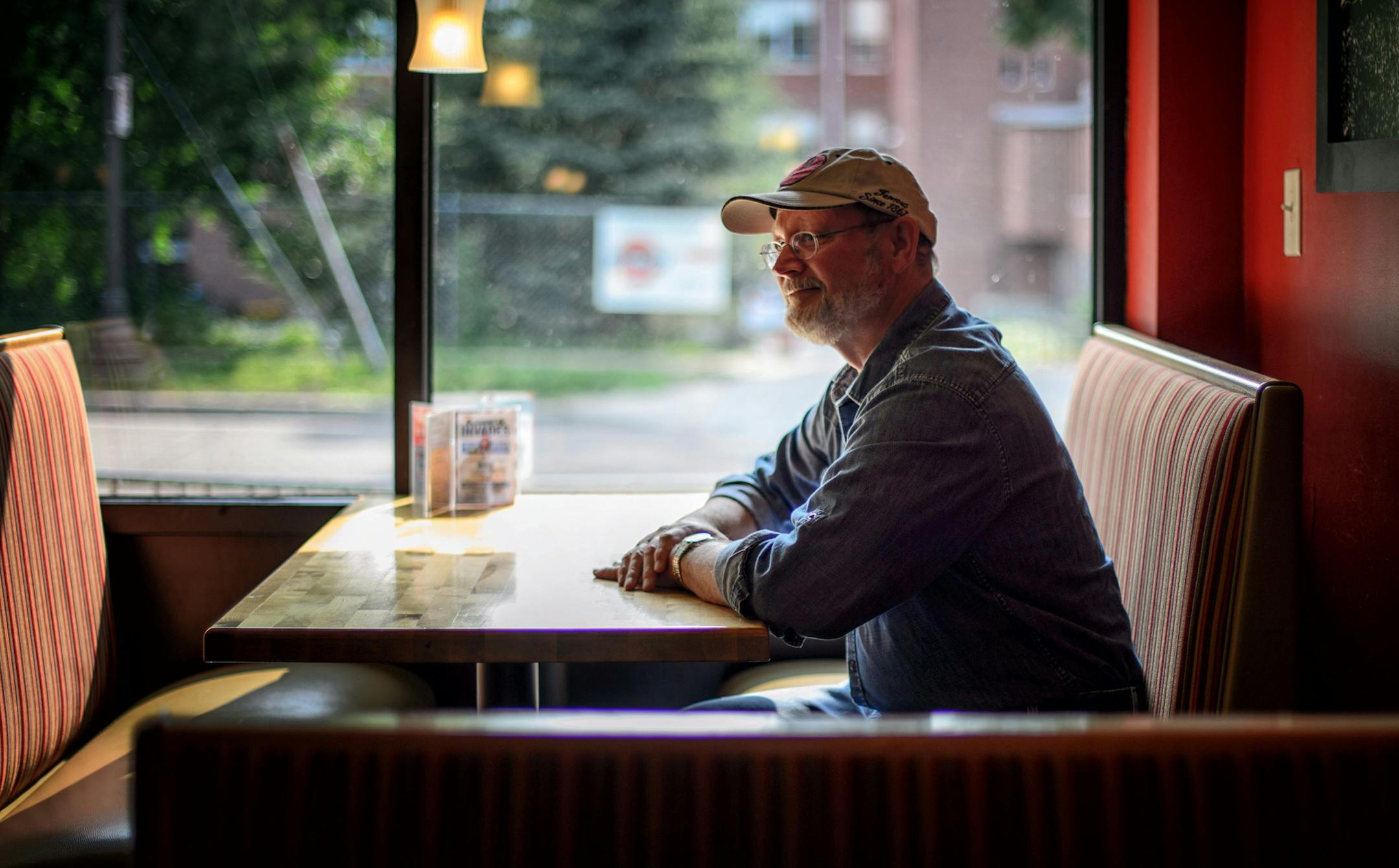 Author William Kent Krueger sat in his favorite seat where he does his writing, at the Como Park Grill, St. Paul. ] Thursday, July 31, 2014. GLEN STUBBE * gstubbe@startribune.com