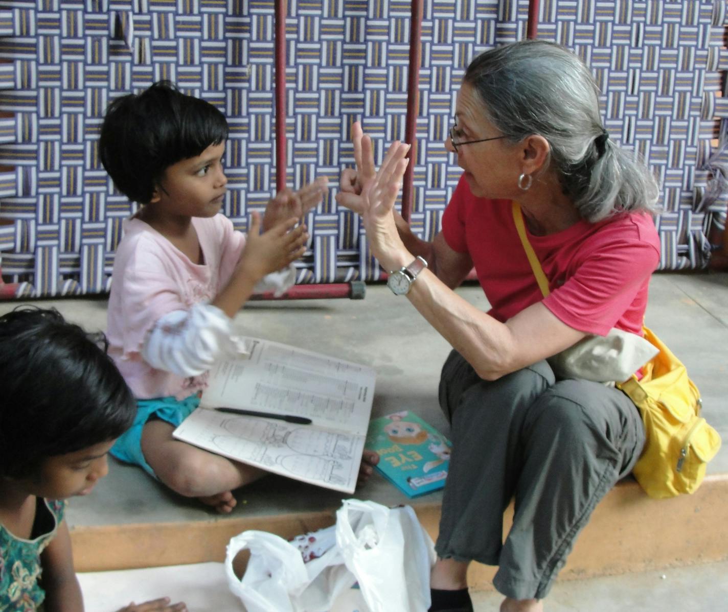 COURTESY GLOBAL VOLUNTEERS. Kathy Bender, a volunteer with Global Volunteers in St. Paul, counts with students from Chennai, India