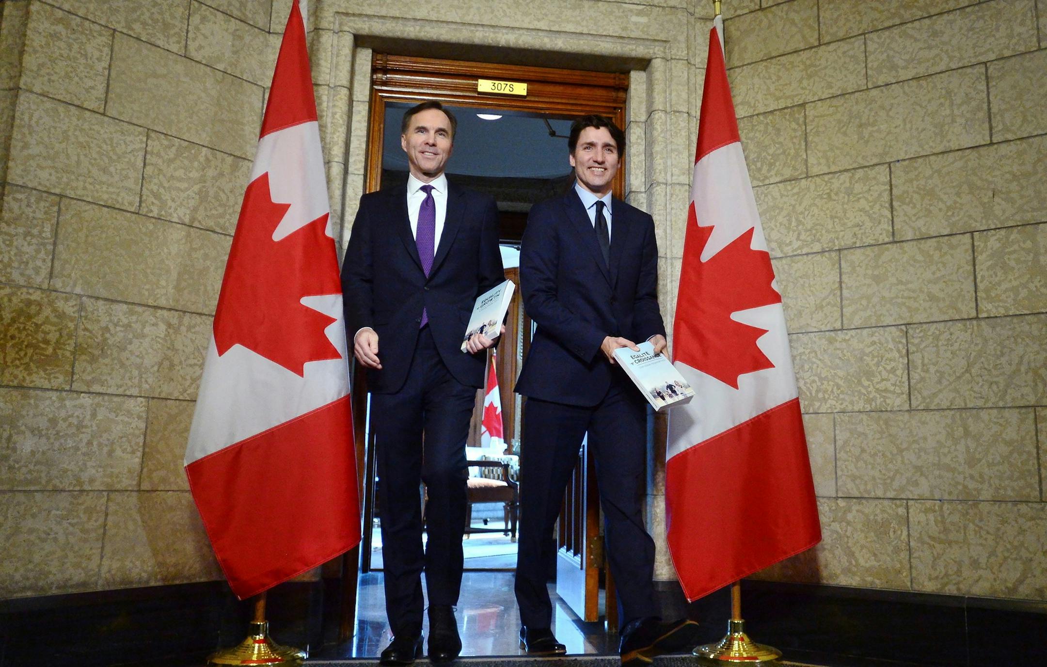 Finance Minister Bill Morneau and Prime Minister Justin Trudeau leave the prime minister's office to table the federal budget in the House of Commons in Ottawa on Tuesday, Feb. 27, 2018. (Sean Kilpatrick/The Canadian Press via AP) ORG XMIT: CPOTK