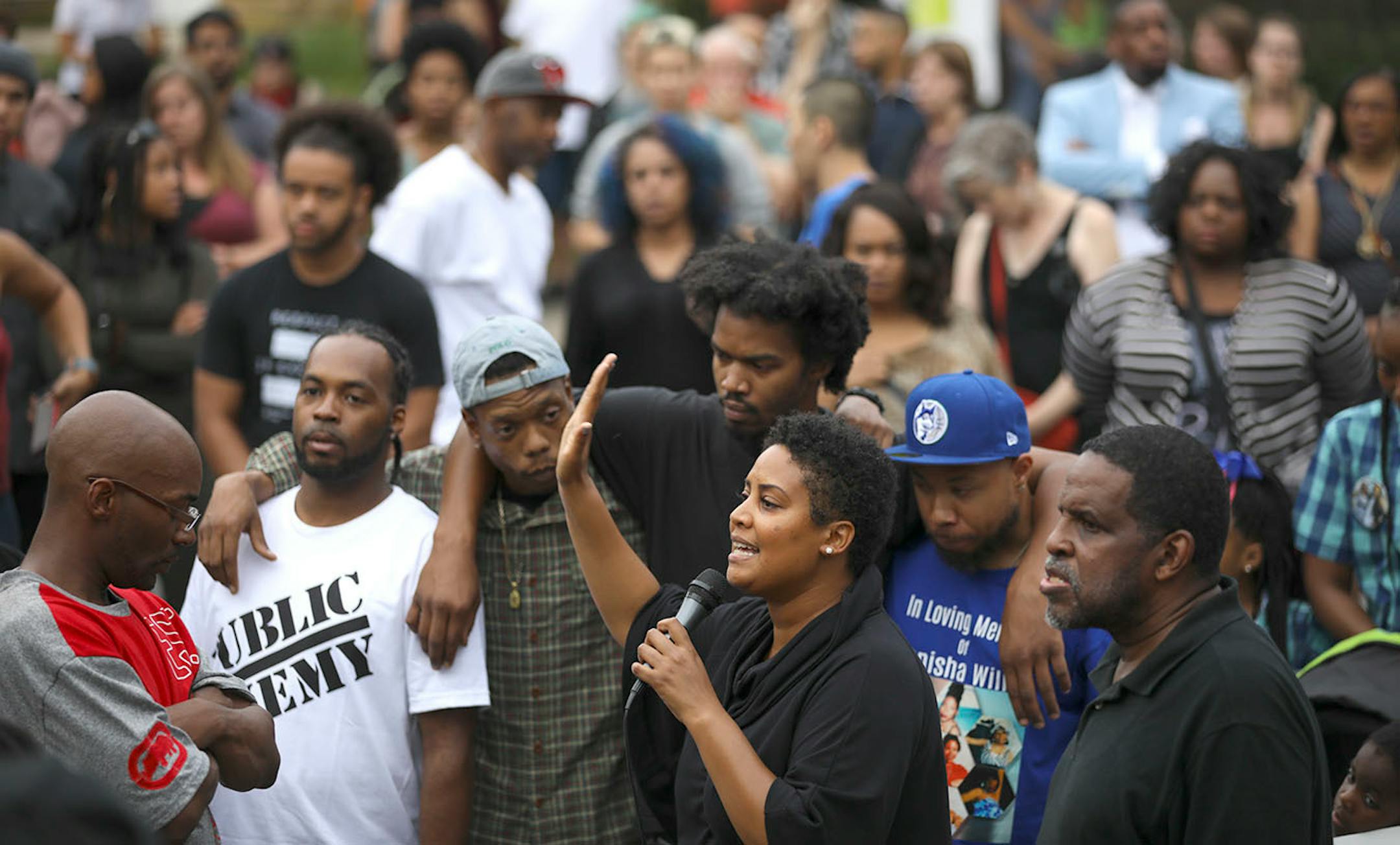 Former city council candidate Raeisha Williams, whose brother was killed earlier this year, spoke to the crowd gathered at 47th and Camden Ave. N.