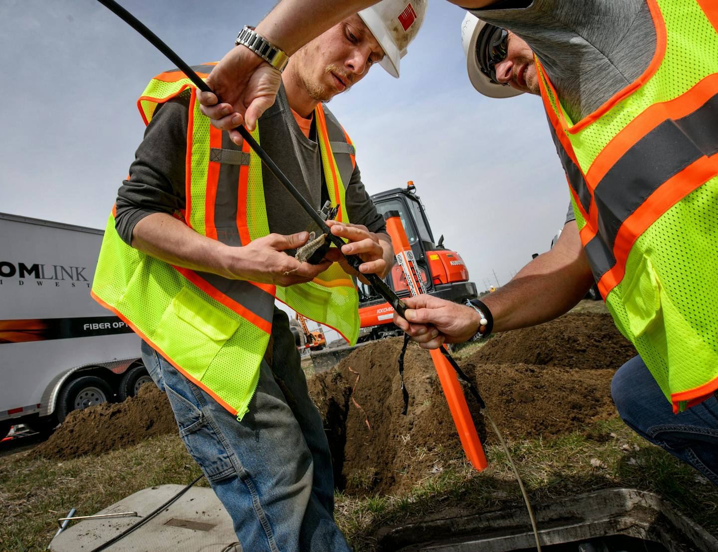 Nate Baumgarten and Eric Graning of ComLink Midwest installed a new fiber optic line for Palmer Wireless. The line was for a Great River Energy substation. ] GLEN STUBBE * gstubbe@startribune.com Friday, April 15, 2016 A crew for ComLink Midwest installed a fiber optic cable for Palmer Wireless who received a state grant to supply high speed broadband to Becker Industrial Park.