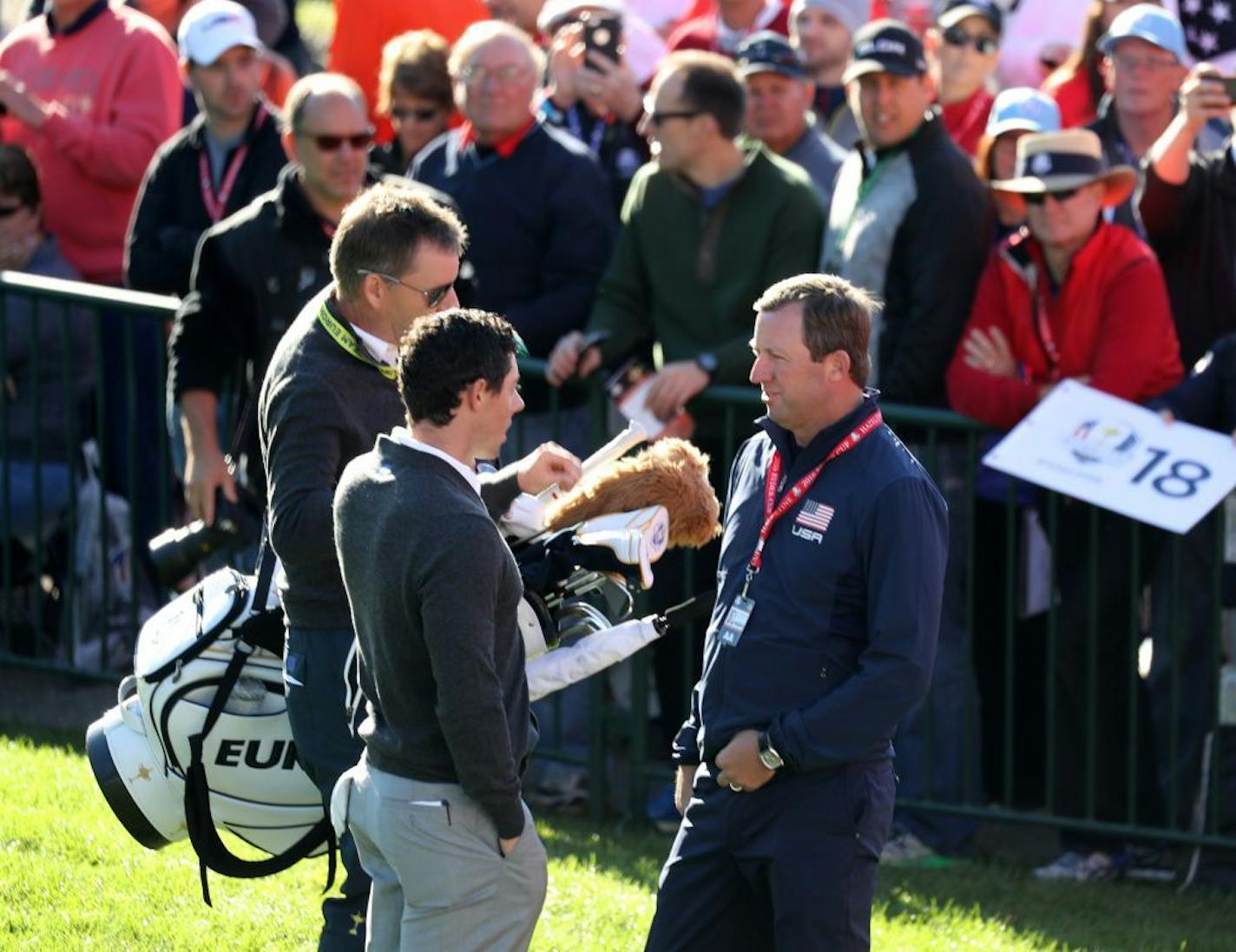 Team Europe's Rory McIlroy talked with Hazeltine�s head golf pro Chandler Withington after practicing his putting in front of a large crowd Thursday morning at Hazeltine National Golf Club.