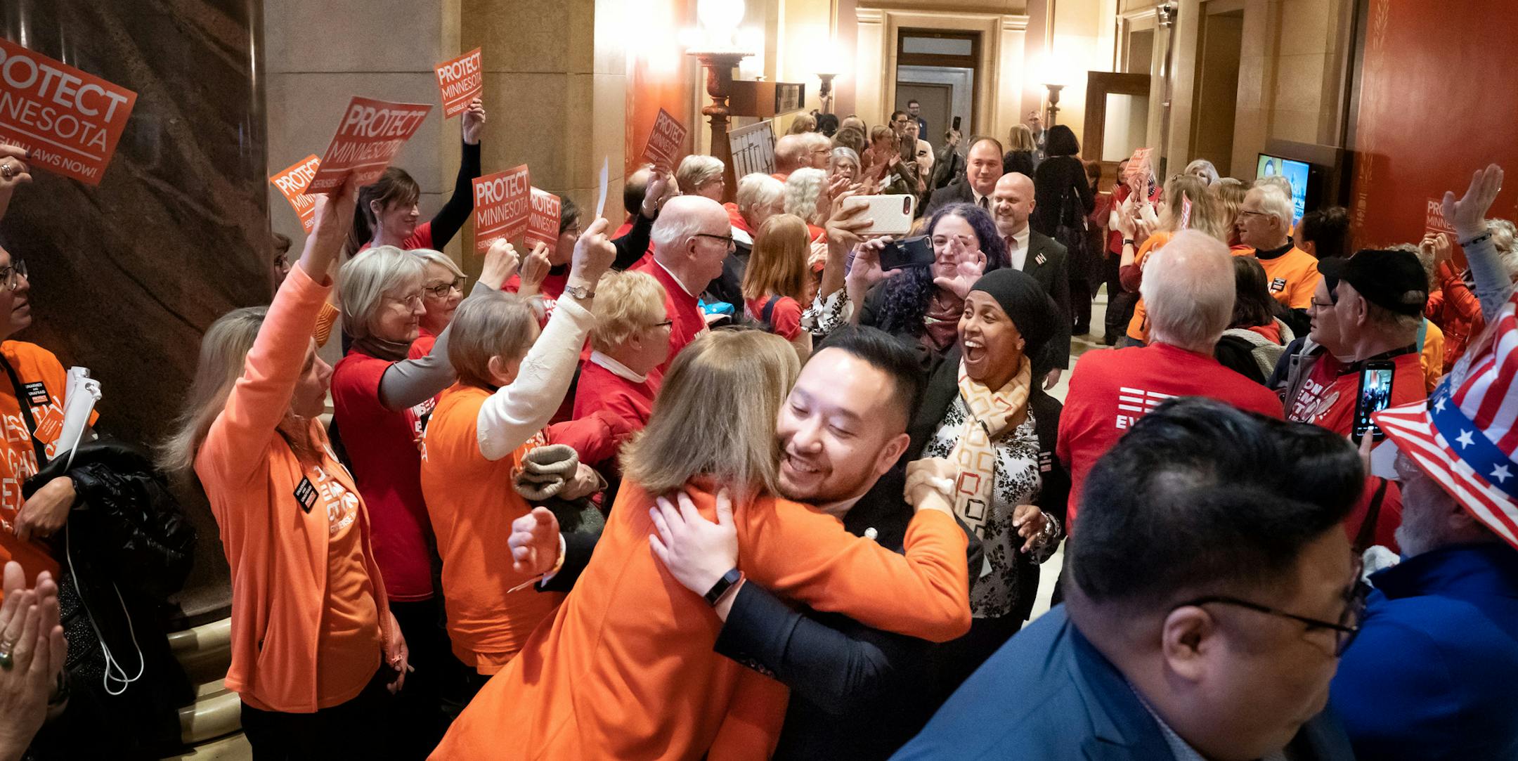 Gun safety advocates from Protect Minnesota and Moms Demand Action chanted and cheered on DFL legislators who plan to vote for bills today that would expand background checks and a new red flag law. Front to back are Rep. Jay Xiong, DFL-St. Paul, Rep. Fue Lee, DFL-Minneapolis, Rep. Hodan Hassan, DFL-Minneapolis, Rep. Aisha Gomez, DFL-Minneapolis, Rep. Mike Freiberg, DFL-Golden Valley, Rep. John Huot, DFL-Rosemount. ] GLEN STUBBE • glen.stubbe@startribune.com Thursday, February 27, 2020 Th