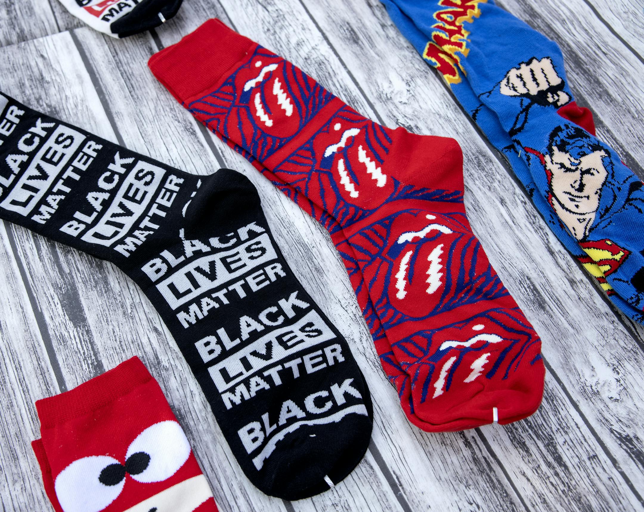 An assortment of socks for sale at the Black Entrepreneur State Fair at Father Hennepin Bluff Park in Minneapolis. ] CARLOS GONZALEZ • cgonzalez@startribune.com – Minneapolis, MN – August 27, 2020, The Black Entrepreneur State Fair will run through Saturday. On Thursday it goes from 4-8 pm at Father Hennepin Bluff Park