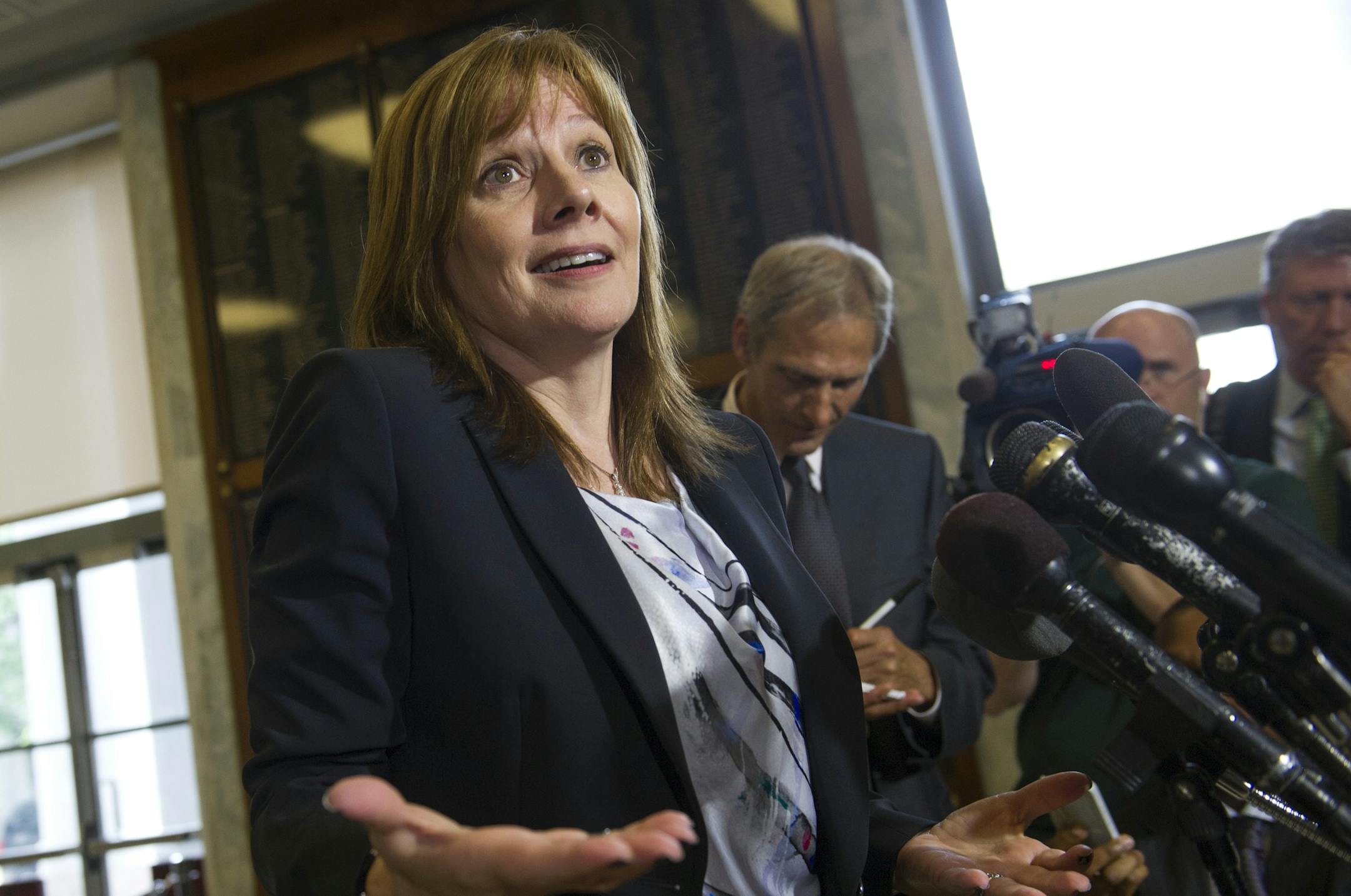 General Motors CEO Mary Barra speaks during a news conference on Capitol Hill in Washington, Wednesday, June 18, 2014, following her testimony before the House Oversight and Investigations subcommittee hearing examining the facts and circumstances that contributed to General Motors’ failure to identify a safety defect in certain ignition switches and initiate a recall in a timely manner. (AP Photo/Cliff Owen)