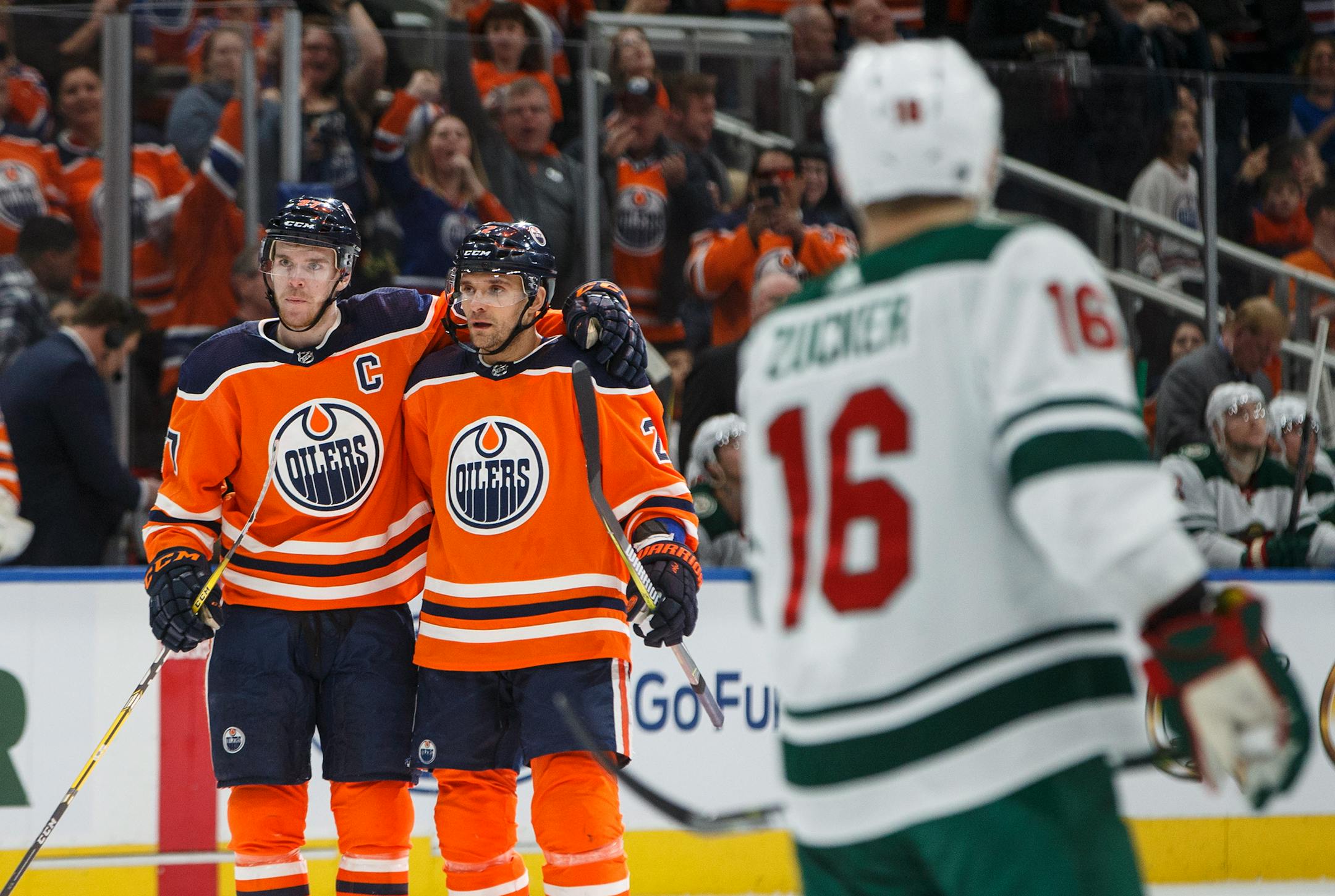 Edmonton Oilers center Connor McDavid (97) and defenseman Andrej Sekera (2) celebrate a goal against the Minnesota Wild during the second period of an NHL hockey game Saturday, March 10, 2018, in Edmonton, Alberta. (Jason Franson/The Canadian Press via AP)