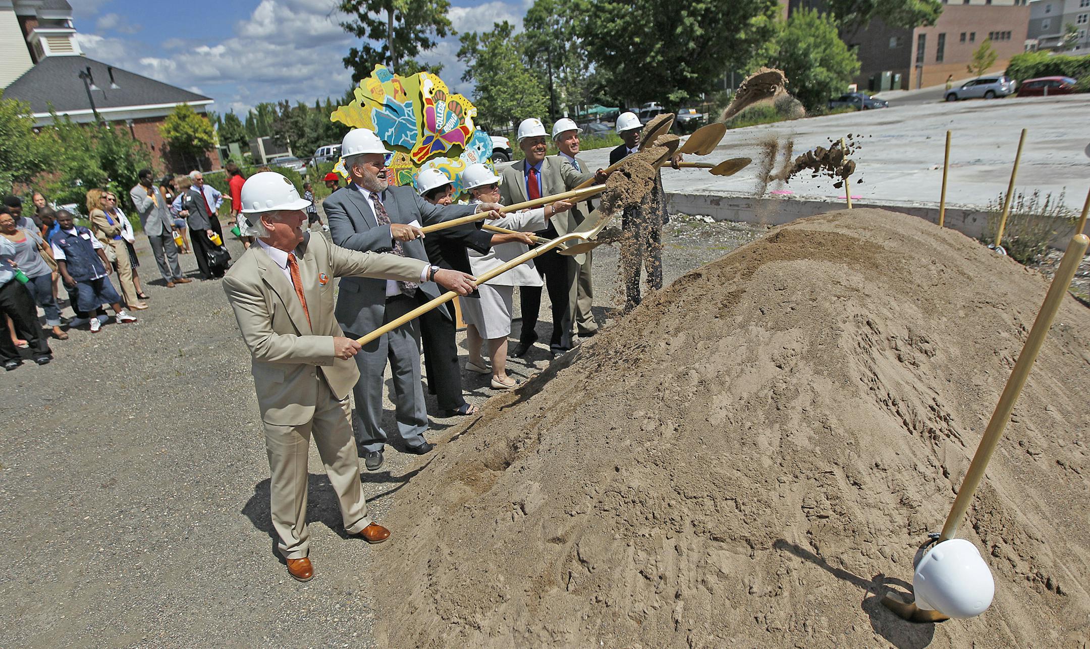Former anchor Don Shelby, far left, led community leaders to a dirt pile during the groundbreaking ceremony of what will be a new $24.5 million Washburn Center for Children, Tuesday, August 13, 2013. The center will be a children's mental health center in North Minneapolis. Washburn Center for Children is a resource center that helped children experiencing social, emotional, and behavioral changes. The center serves more than 10,000 community members annually.(ELIZABETH FLORES/STAR TRIBUNE) ELIZ