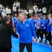 Simley coach Will Short, his team behind him, accepted his medal after the program's sixth state championship in a row.