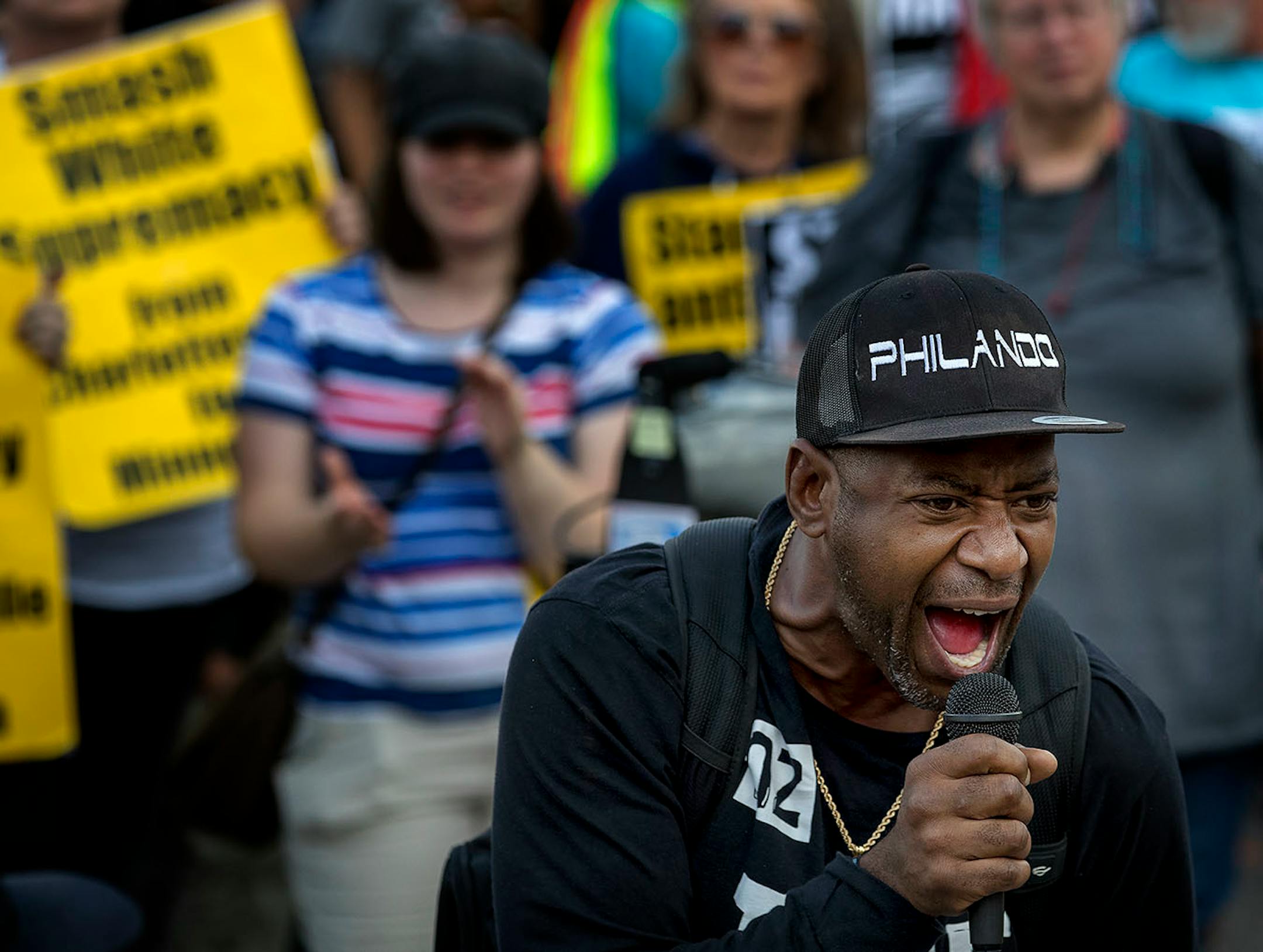 John Thompson spoke before a Solidarity with anti-racists in Charlottesville march in front of the Republican Party office on Franklin Avenue in Minneapolis on Monday.