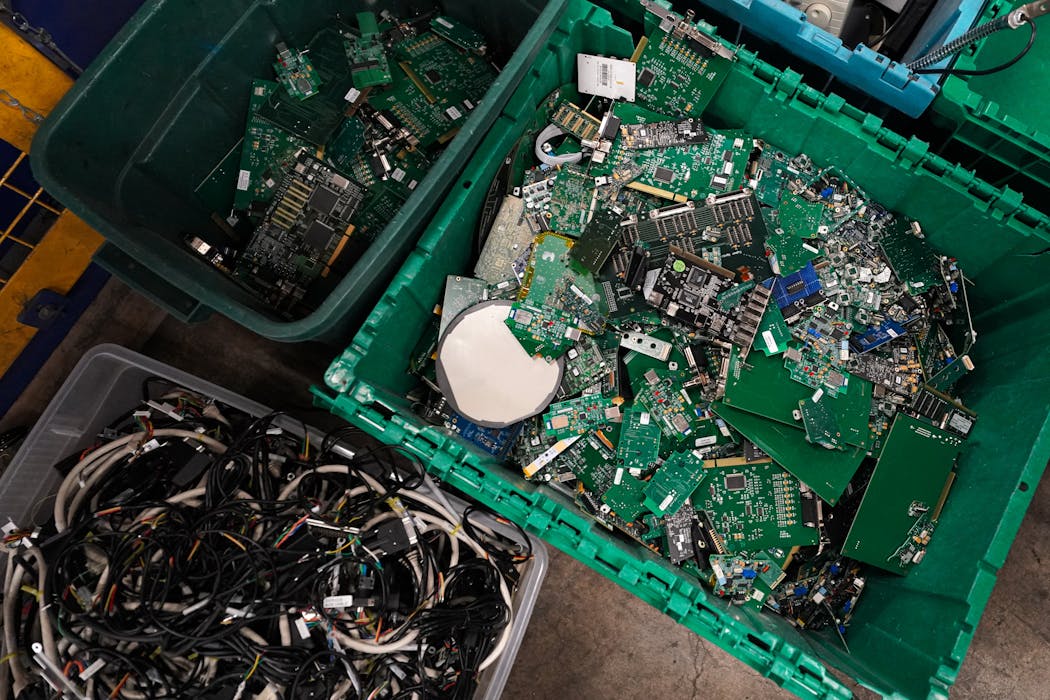 Circuit boards containing small amounts of gold are separated from cords and wires for recycling at Repowered.