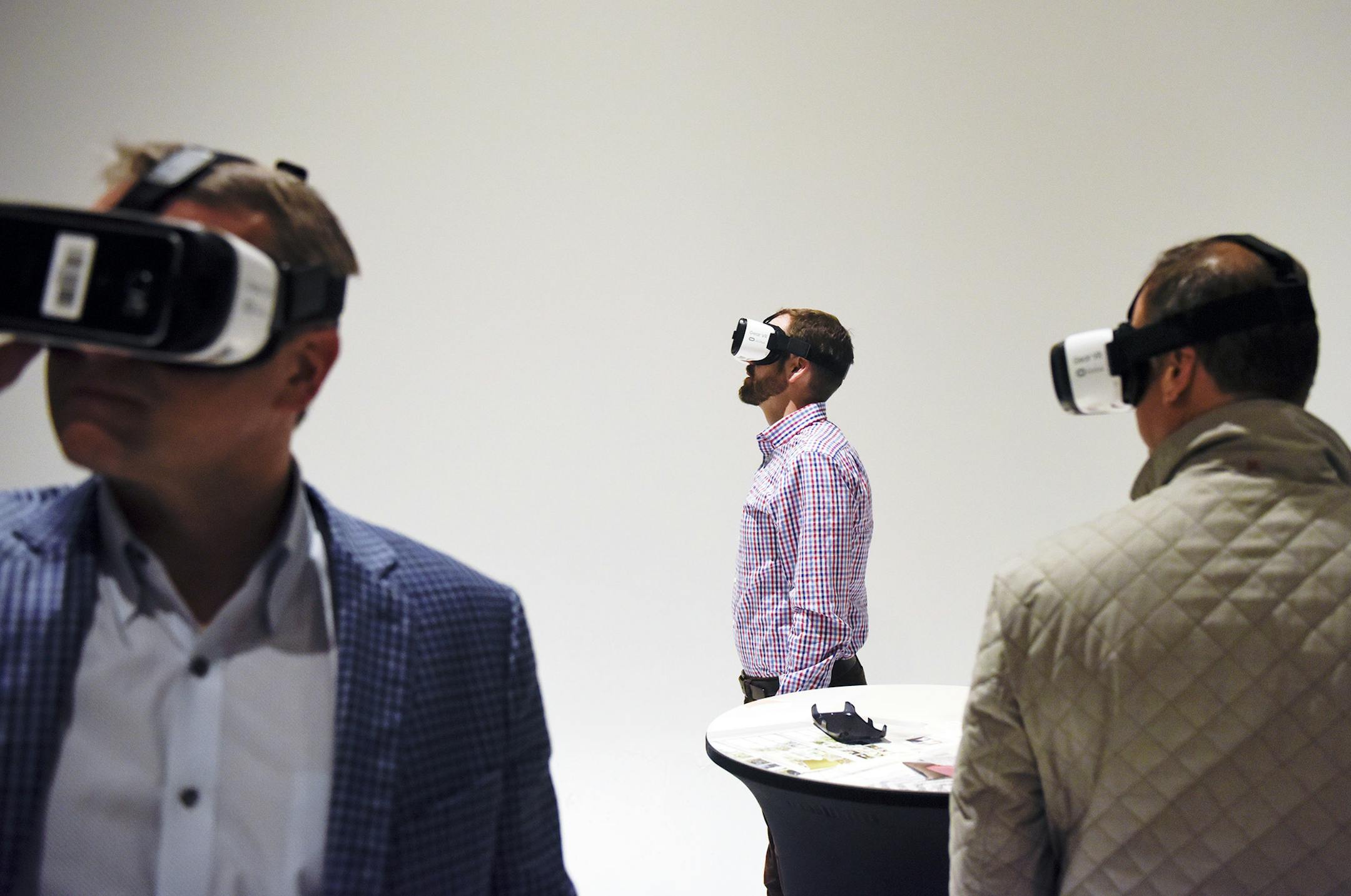 Real estate professionals try virtual reality tours technology at a Virtual Broker Open House event held at Realvision’s Minneapolis office in February. (Photo provided by Matt Mead/Spacecrafting.)