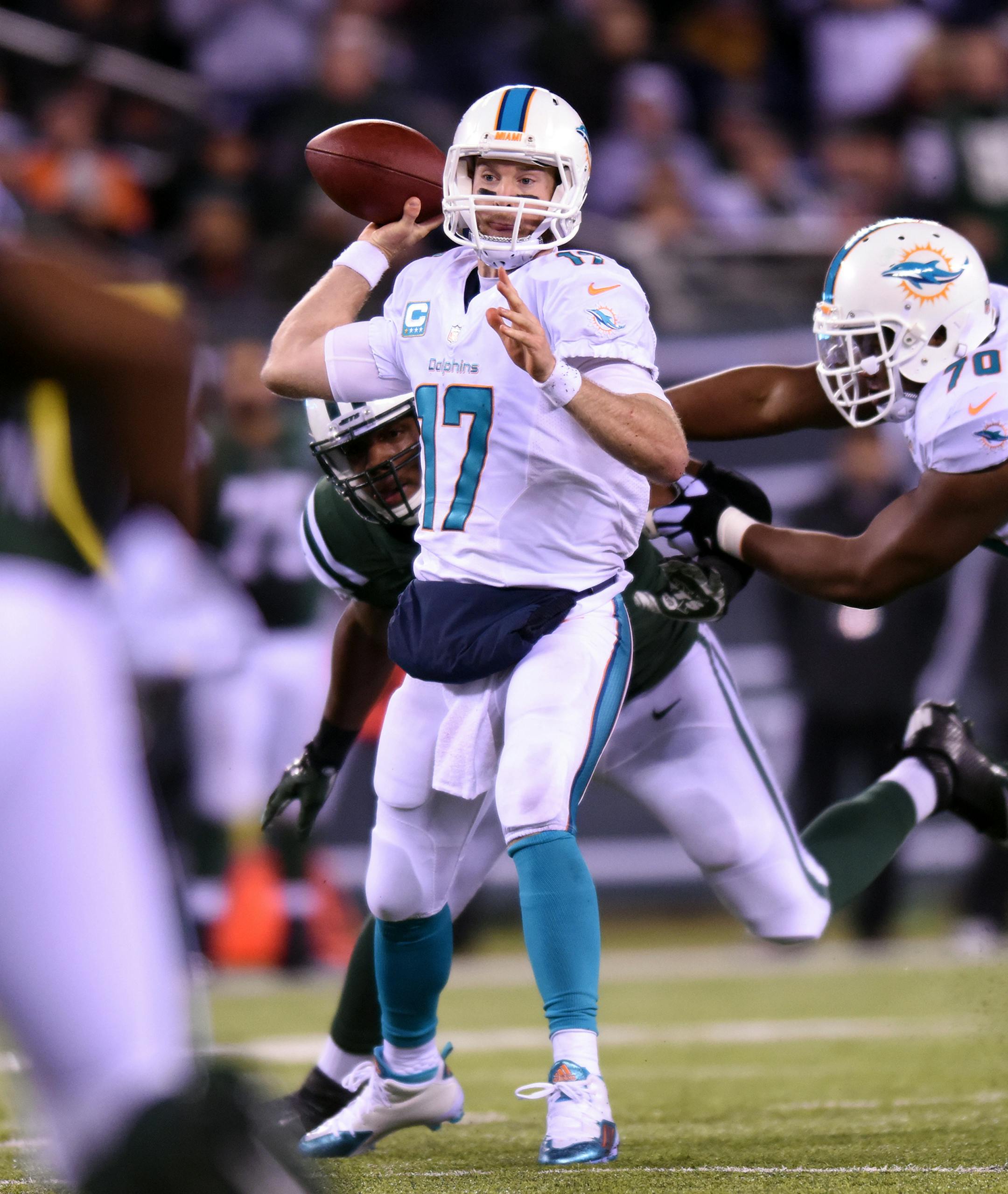 Miami Dolphins quarterback Ryan Tannehill drops back to pass during the first half on Monday, Dec. 1, 2014, at MetLife Stadium in East Rutherford, N.J. (Jim Rassol/Sun Sentinel/TNS) ORG XMIT: 1160838