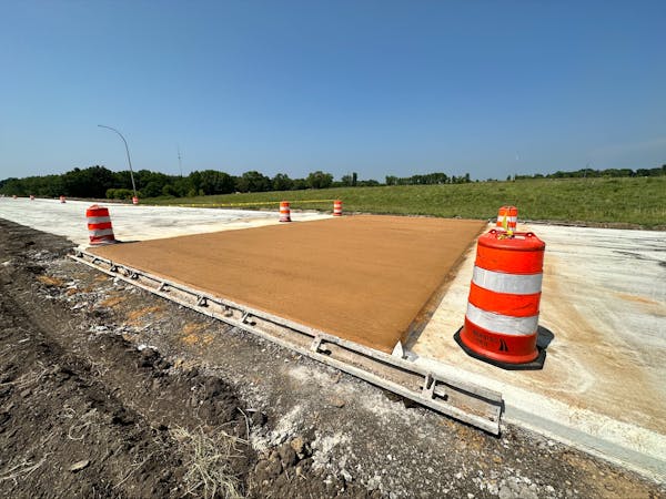 Gold-tinted concrete installed on I-90 near Blue Earth, Minn., marks the spot where the transcontinental freeway was completed in 1978.