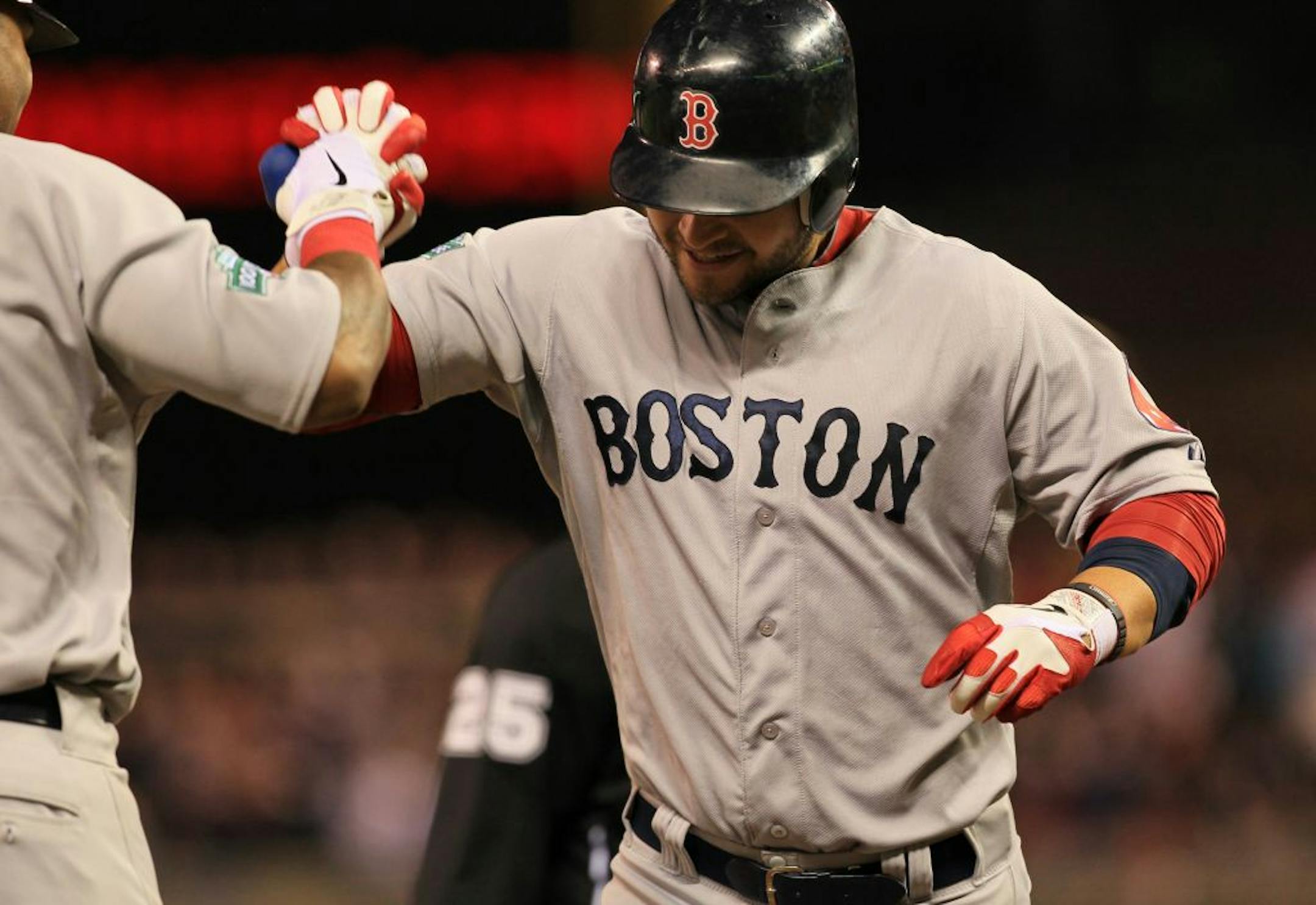 Red Sox Cody Ross celebrated his second and game winning home run in the ninth inning during a baseball game between the Twins and the Red Sox on Monday, April 23, 2012 in Minneapolis, Minn. at Target Field.