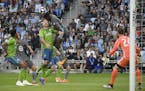 Minnesota United defender Ike Opara (3) scored a goal off a header as he collided with Seattle Sounders defender Chad Marshall (14) in the first half.