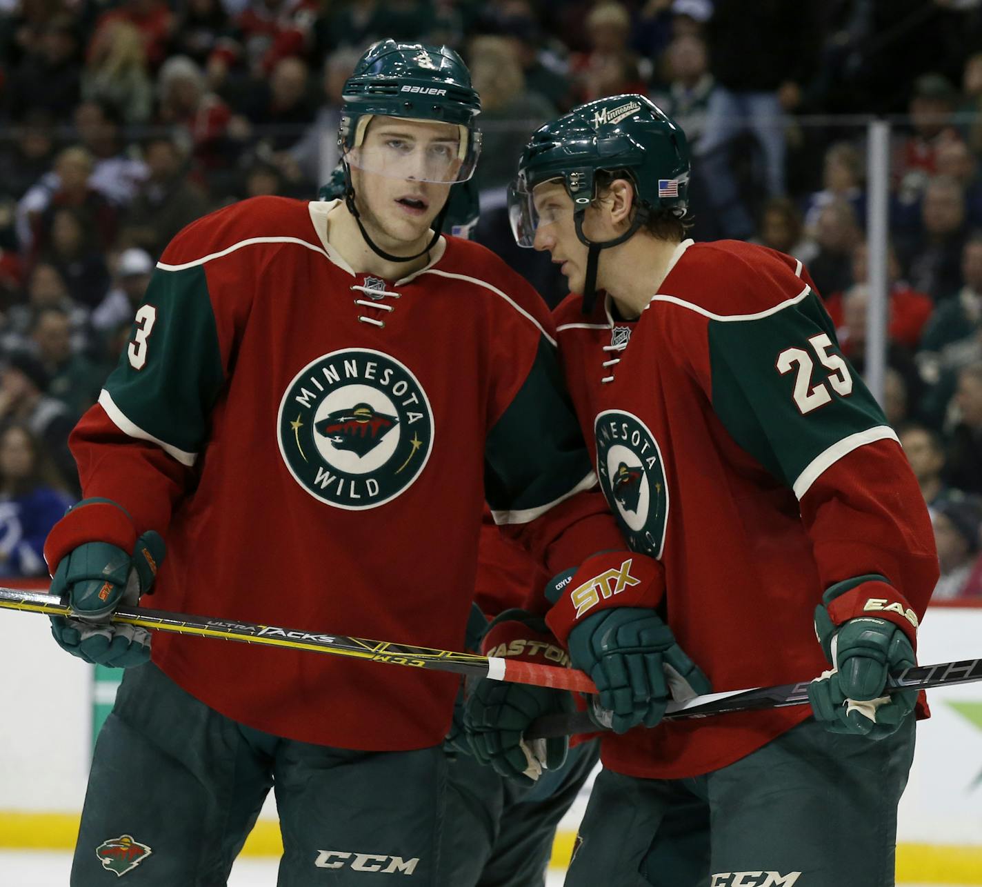 Minnesota Wild center Charlie Coyle (3) listens to Minnesota Wild defenseman Jonas Brodin (25) during the second period of an NHL hockey game against the Tampa Bay Lightning in St. Paul, Minn., Saturday, Nov. 7, 2015. (AP Photo/Ann Heisenfelt)