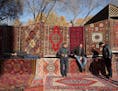 Vendors wait for customers at a patterned rug and carpet store at the Vernissage open-air market in Yerevan, Armenia, on Nov. 19, 2016. MUST CREDIT: B