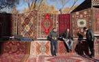 Vendors wait for customers at a patterned rug and carpet store at the Vernissage open-air market in Yerevan, Armenia, on Nov. 19, 2016. MUST CREDIT: B