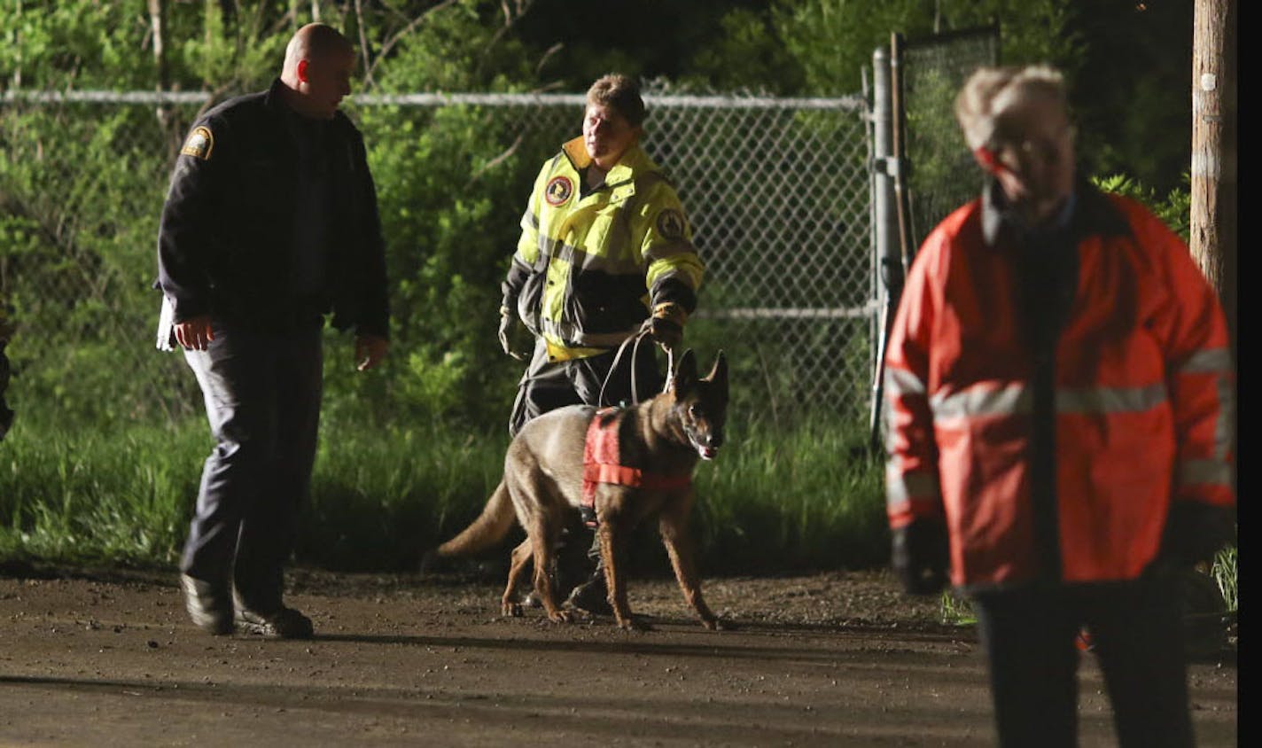 Emergency personnel with a cadaver detecting dog emerged from the area where they were searching Lilydale Regional Park in St. Paul for a missing child Wednesday night. After two dogs searched the area with no results, they call off searching for the night and will begin anew in the morning.