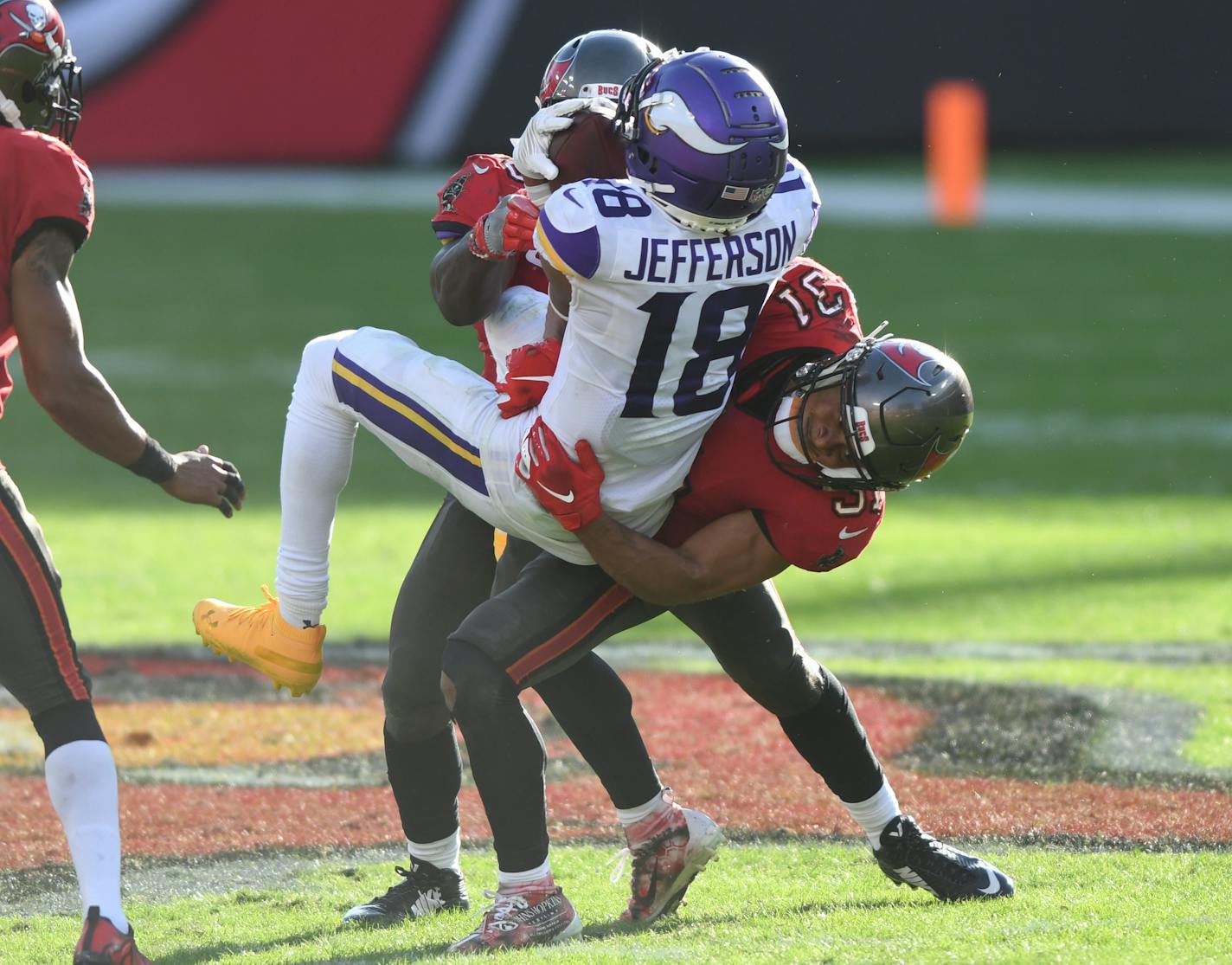 Tampa Bay strong safety Antoine Winfield Jr. (31) takes down Vikings wide receiver Justin Jefferson after a catch during the second half