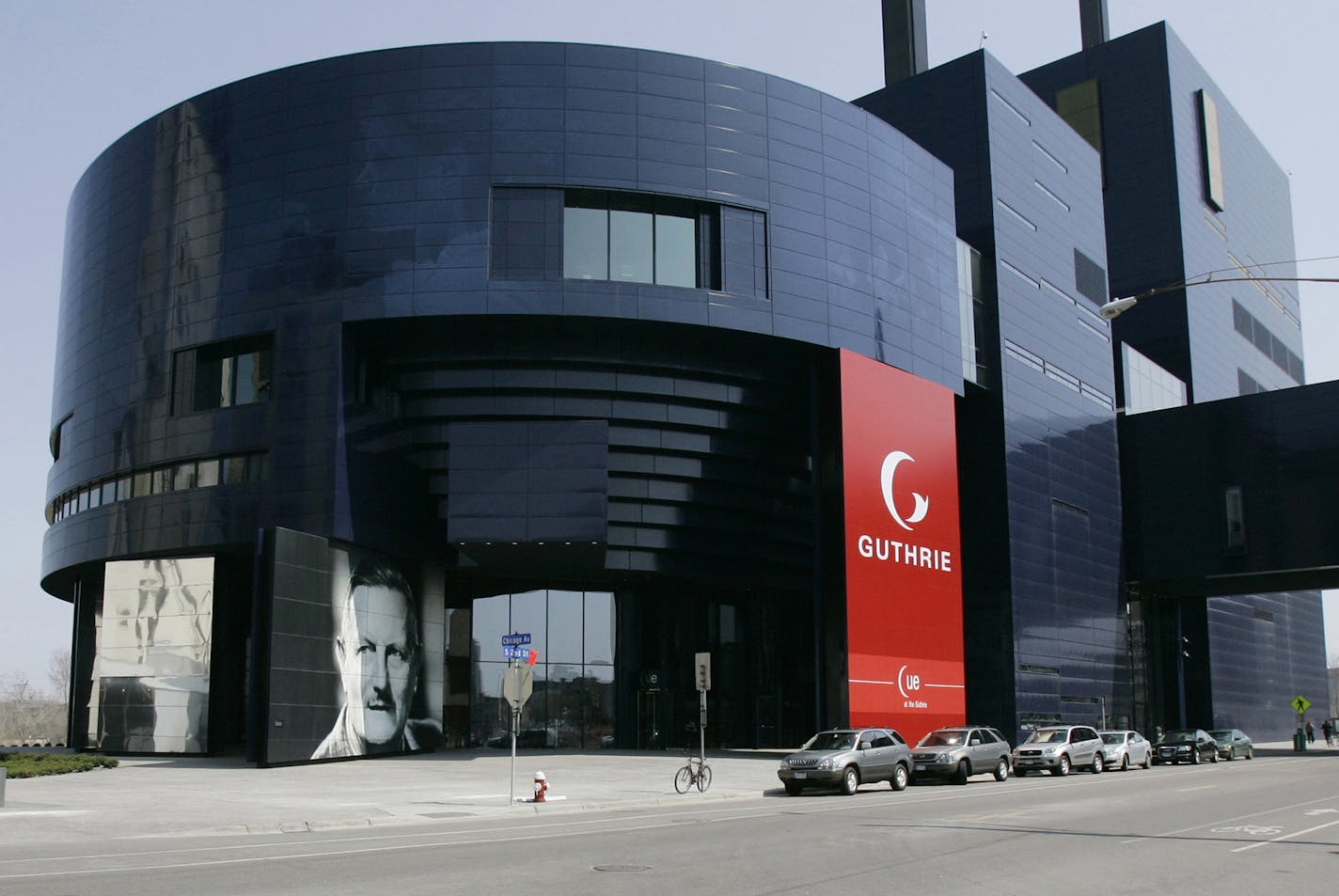 ** FILE ** A photo of Sir Tyrone Guthrie, lower left, graces the front of the Guthrie Theater, in this April 20, 2007 file photo in Minneapolis. French architect Jean Nouvel won the 2008 Pritzker Architecture Prize, it was announced Sunday March 30, 2008. Among the 200 projects singled out by the Pritzker jury was the Guthrie Theater. (AP Photo/Jim Mone, File) ORG XMIT: NY108 ORG XMIT: MIN2013060618524987