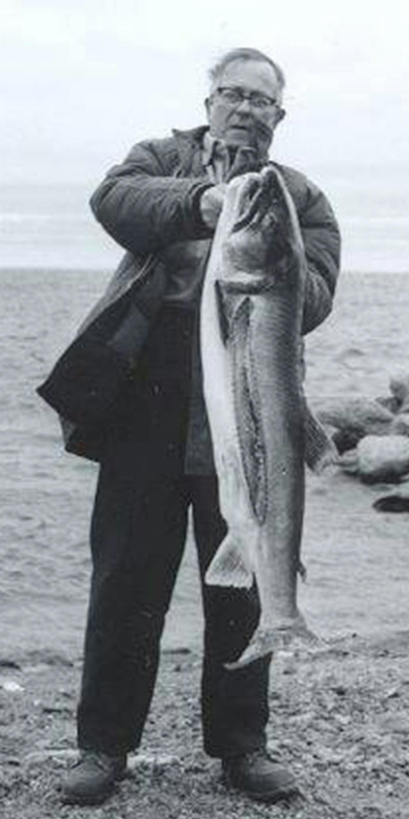 George Herter around 1980 on the shores of Lake Superior, with a lake trout. Photo courtsey Waseca Historical Society