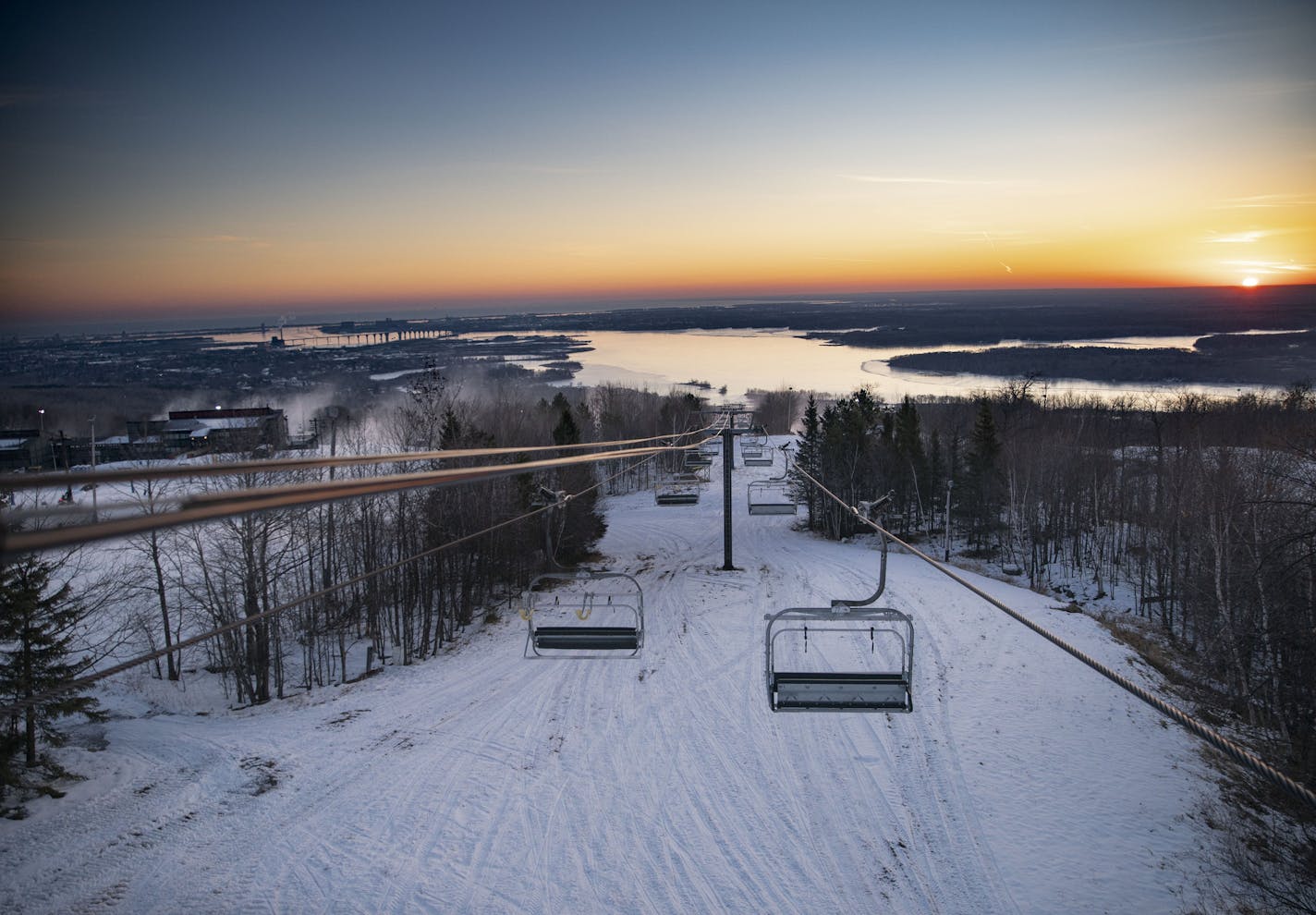 The sun rose over Spirit Mountain casting light on Lake Superior and the St. Louis River on Wednesday December 2, 2020. ]ALEX KORMANN • alex.kormann@startribune.comSpirit Mountain in Duluth is one of the top skiing destinations in Minnesota, with a stunning panoramic view of Lake Superior and the St. Louis River.