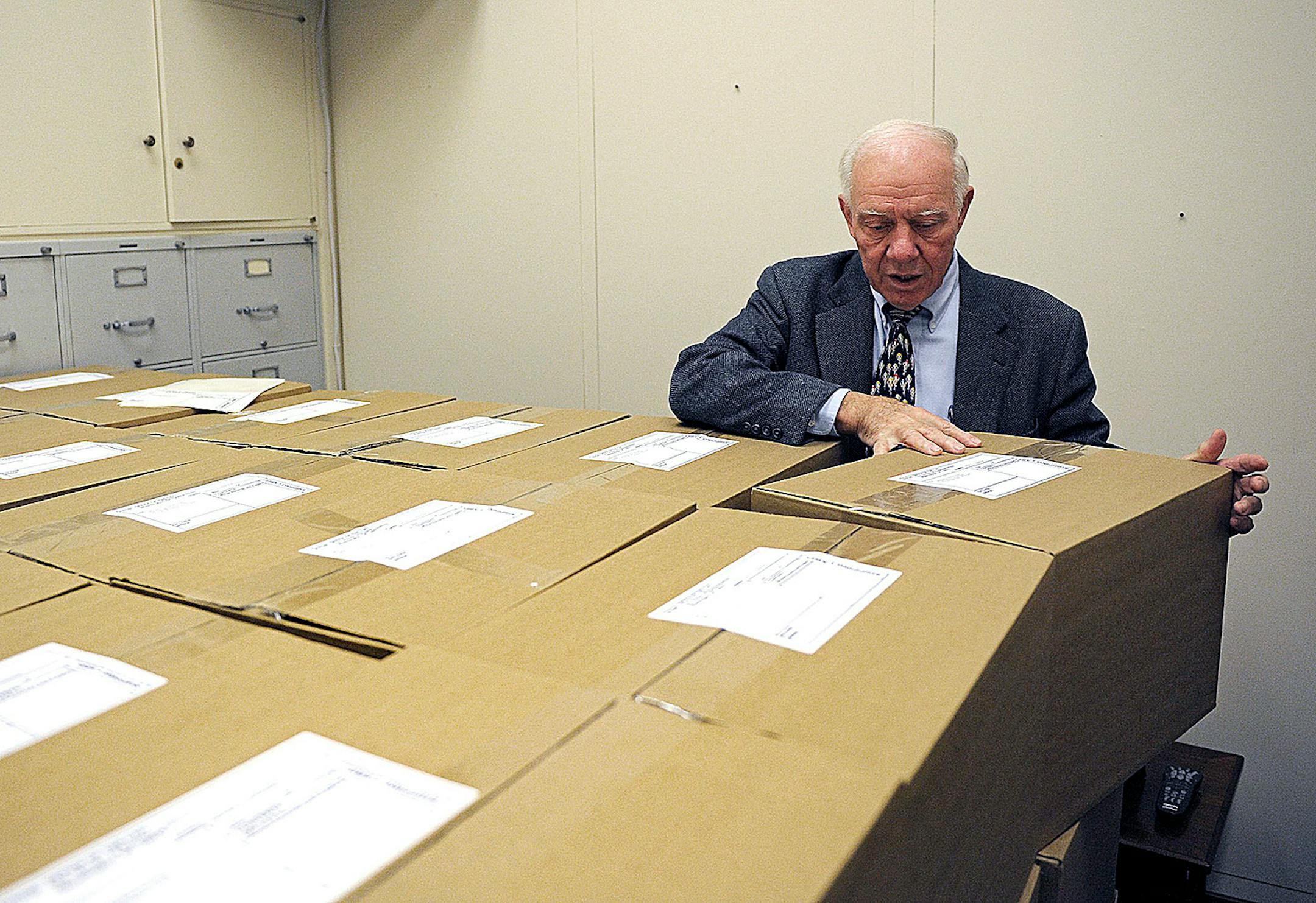 ** SPECIAL TO THE MINNEAPOLIS STAR TRIBUNE ** SA 232340 ** Rep. Jim Oberstar, D-MN, looks over a portion of 98 boxes of his documents which he is sending to the Minnesota Historic Society in his offices on Capitol Hill in Washington, Monday, Nov. 29, 2010. Oberstar lost to Republican Chip Cravaack by approximately 4,000 votes. (AP Photo/Cliff Owen)